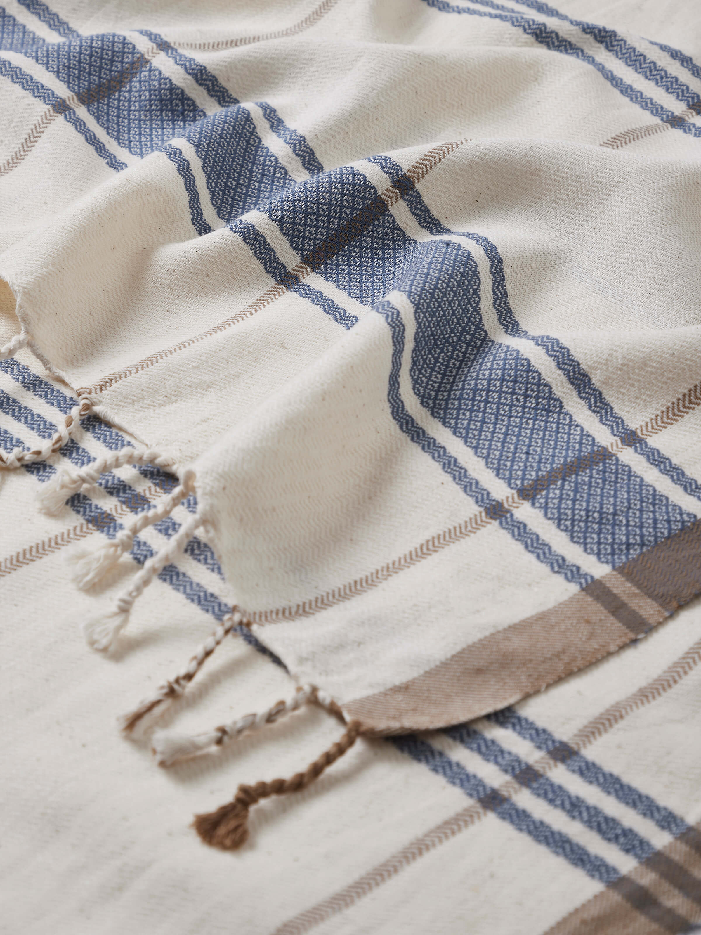 Detailed view of Sarvika blue checks cotton bath towel (L) showing the fabric texture and pattern up close.