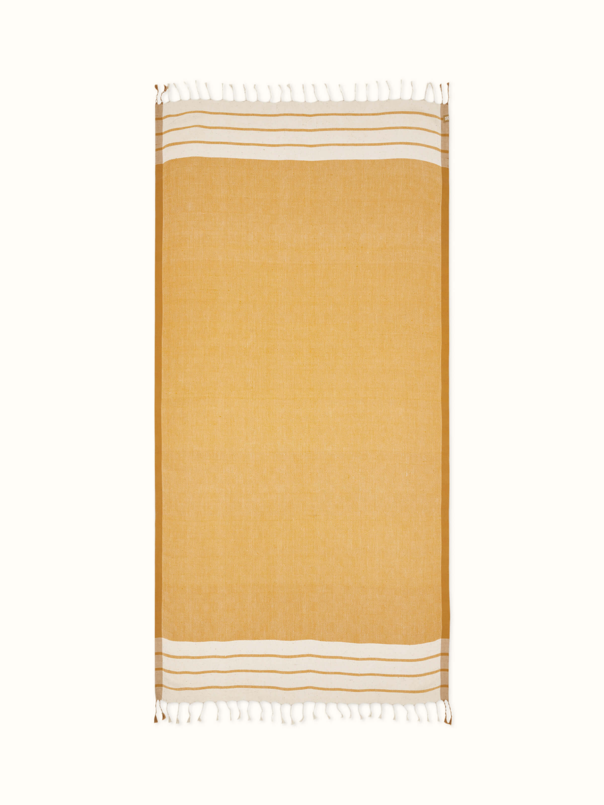 Large yellow cotton bath towel with vibrant stripes, showcasing a soft and absorbent texture.