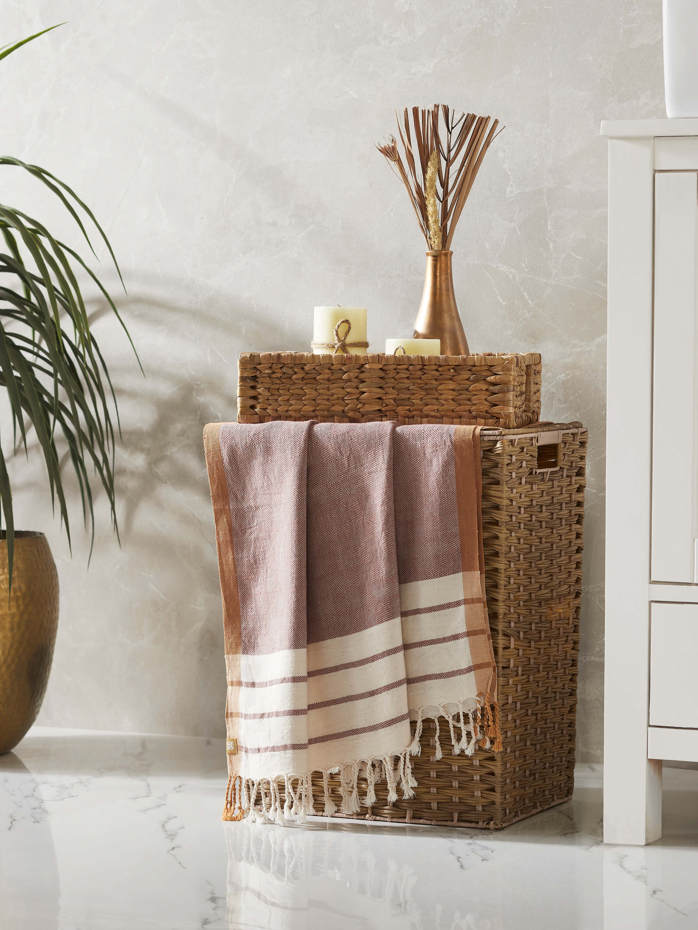 Side view of Samitha Red Stripe Cotton Bath Towel (L) highlighting the red stripes and overall design.