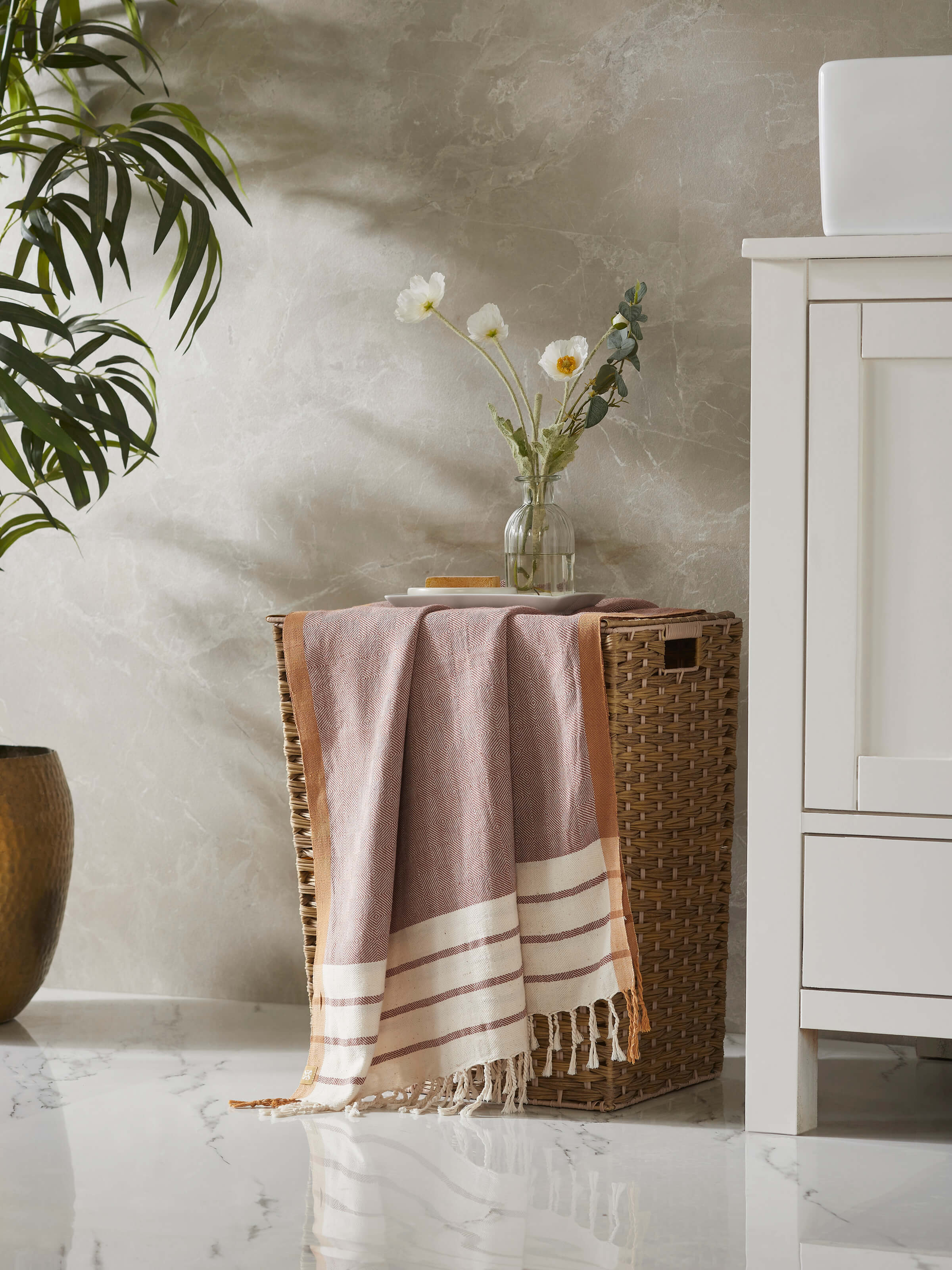 Side view of Samitha red stripe cotton bath towel (M) highlighting the texture and design of the red stripes.