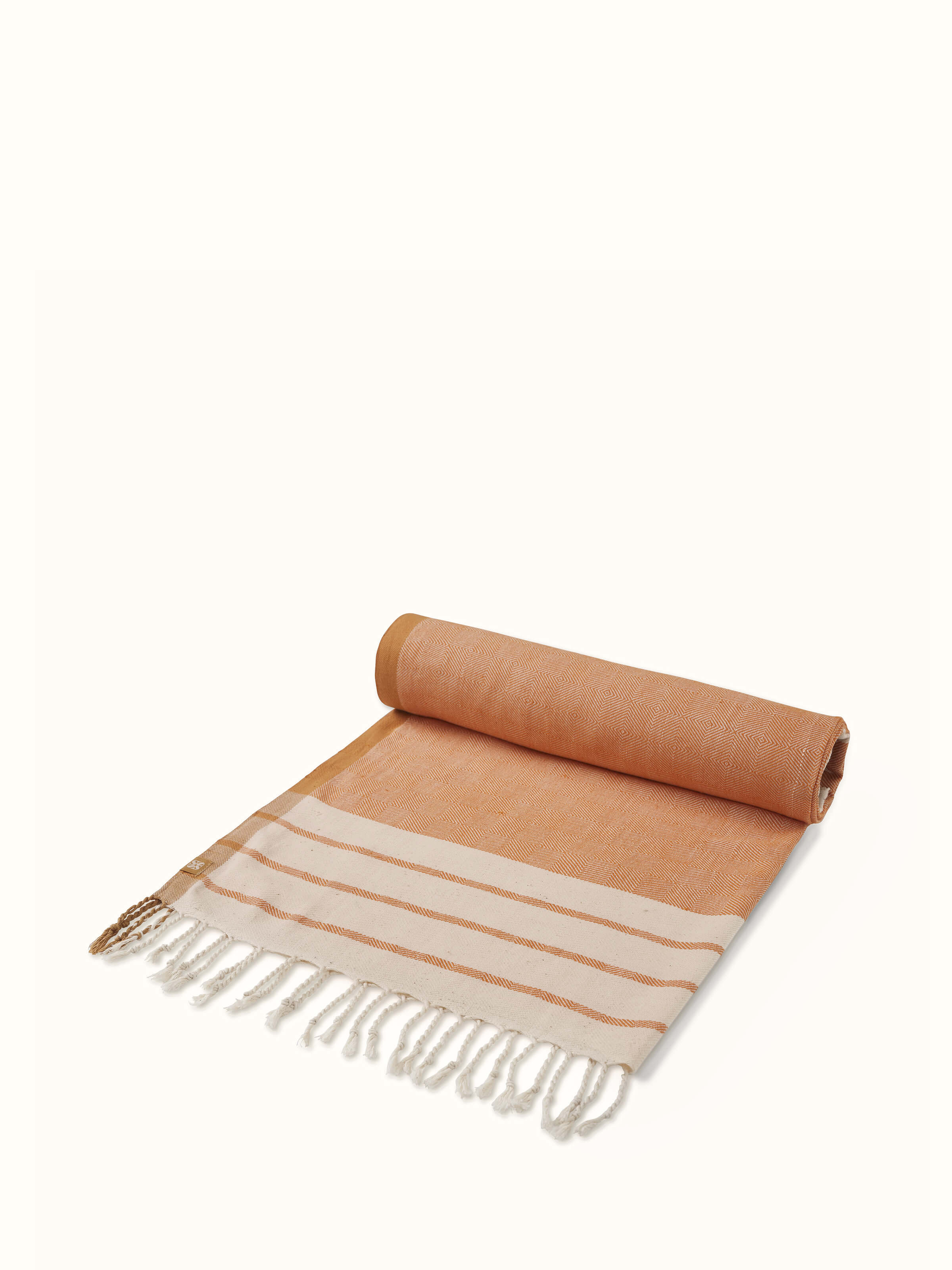 Overhead view of Samitha brown stripe cotton bath towel (L) showing the pattern and color accuracy