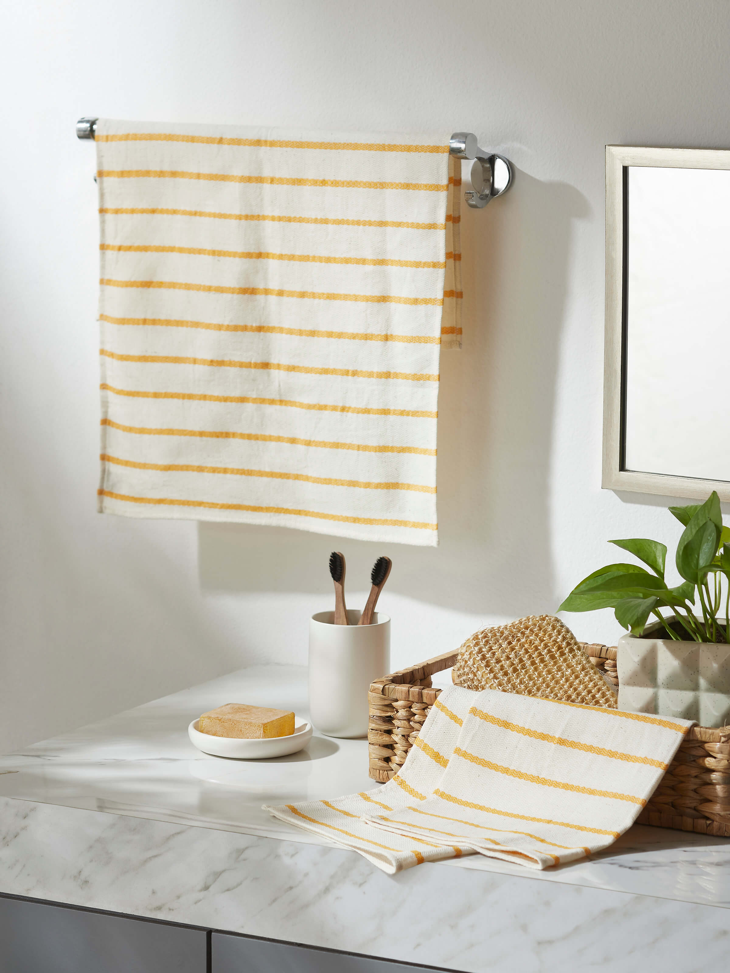 Side view of Samitha yellow stripe cotton hand towels (2 pcs) showing the striped pattern and high absorbency of the cotton material.
