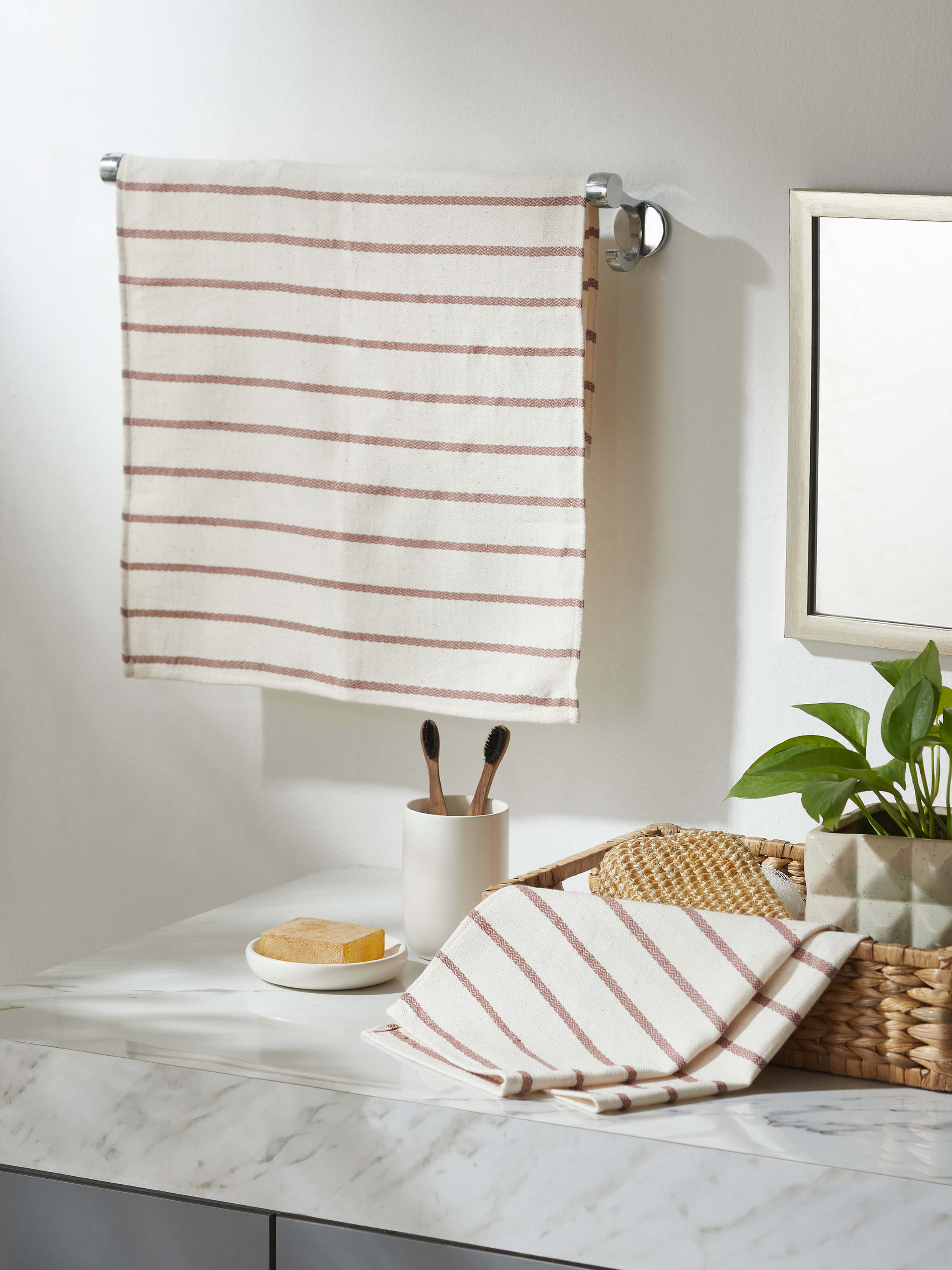 Samitha Rose Stripe Cotton Hand Towels neatly folded, highlighting the classic design and quality cotton fabric