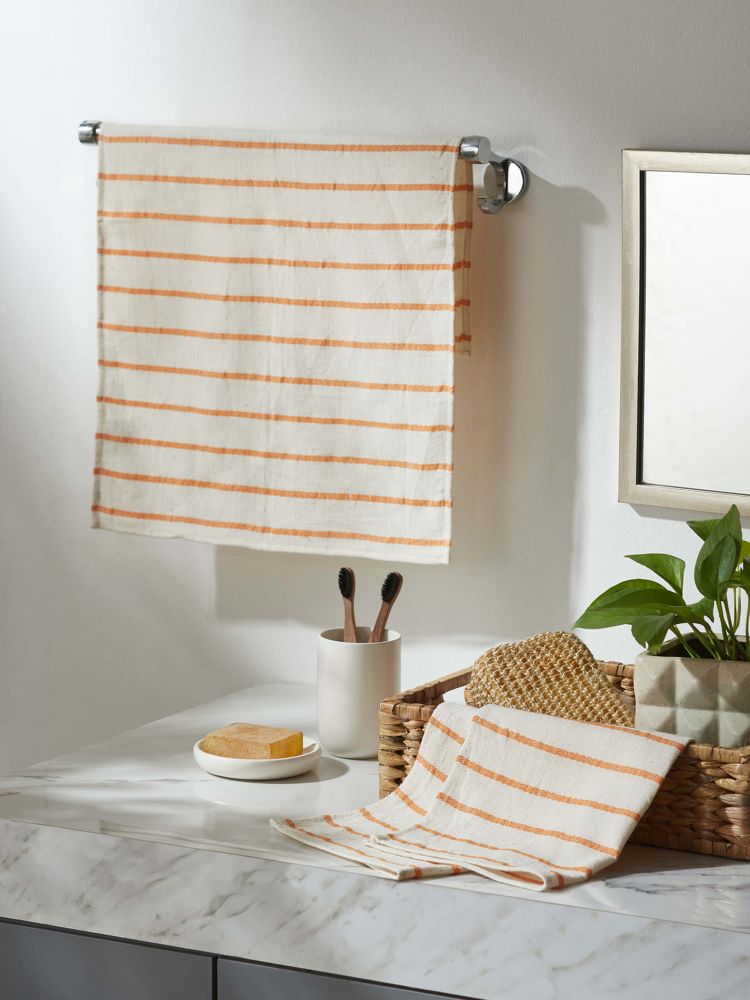 Full view of Samitha rust stripe cotton hand towels, displaying the pattern and overall design.