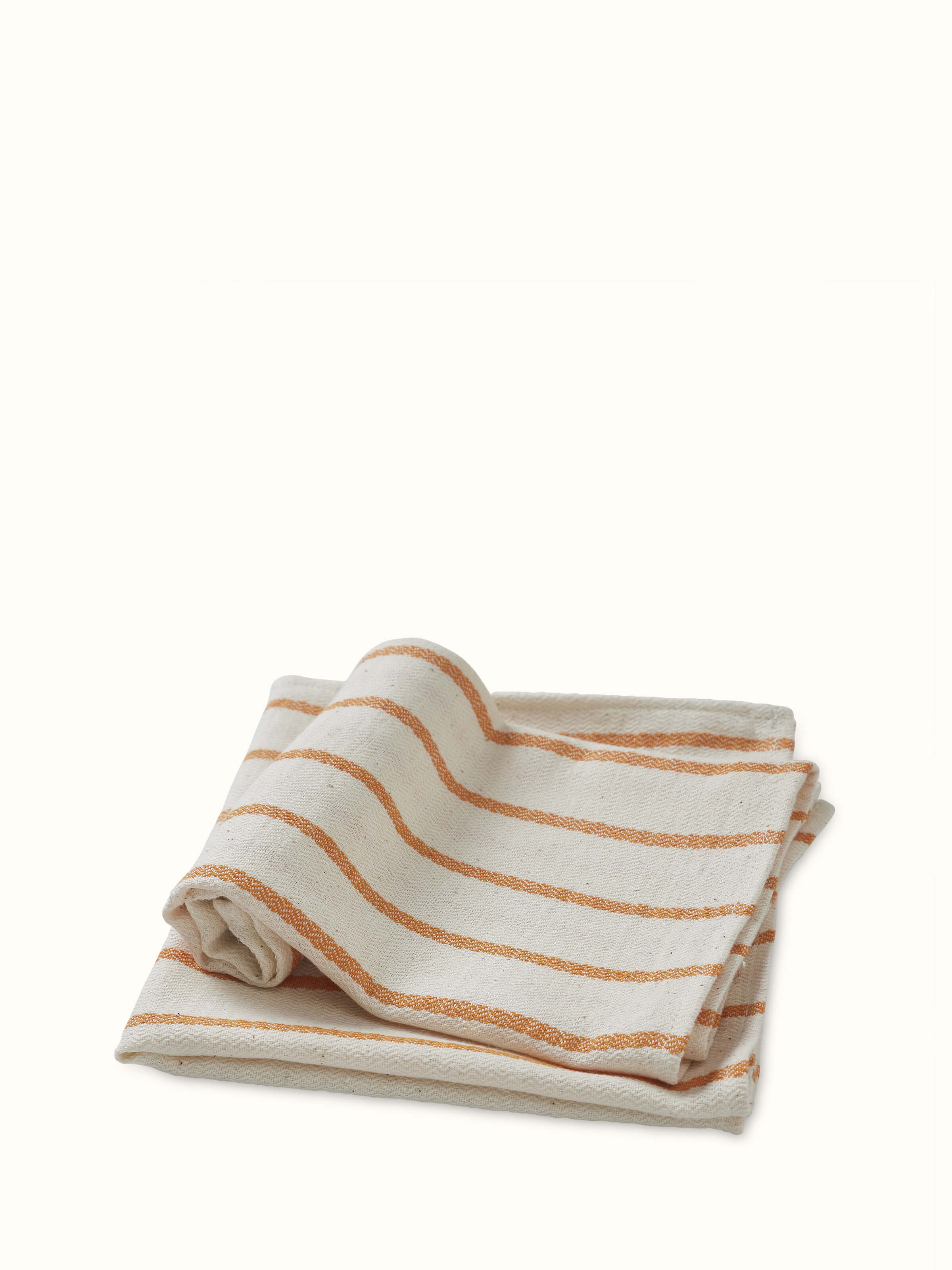 Samitha rust stripe cotton hand towels, showing the stripes and fabric quality in a detailed view.