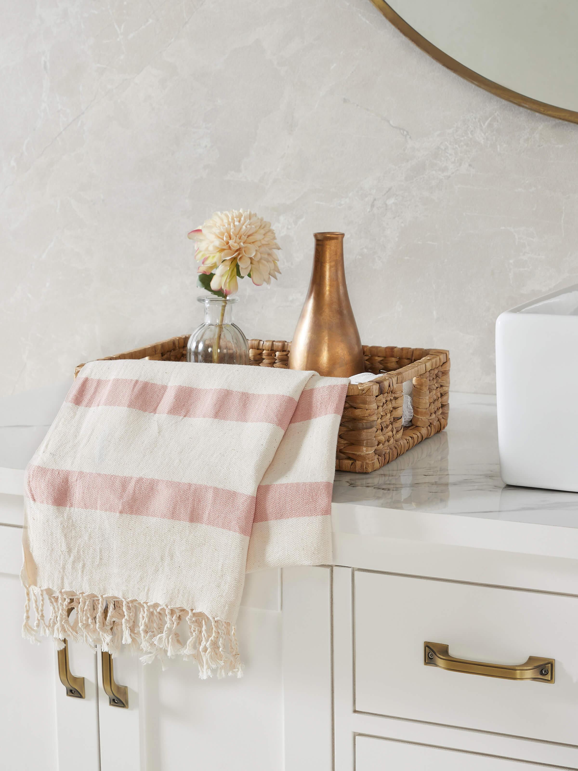 Top view of Salya red stripe cotton striped bath towel (L) showing overall pattern