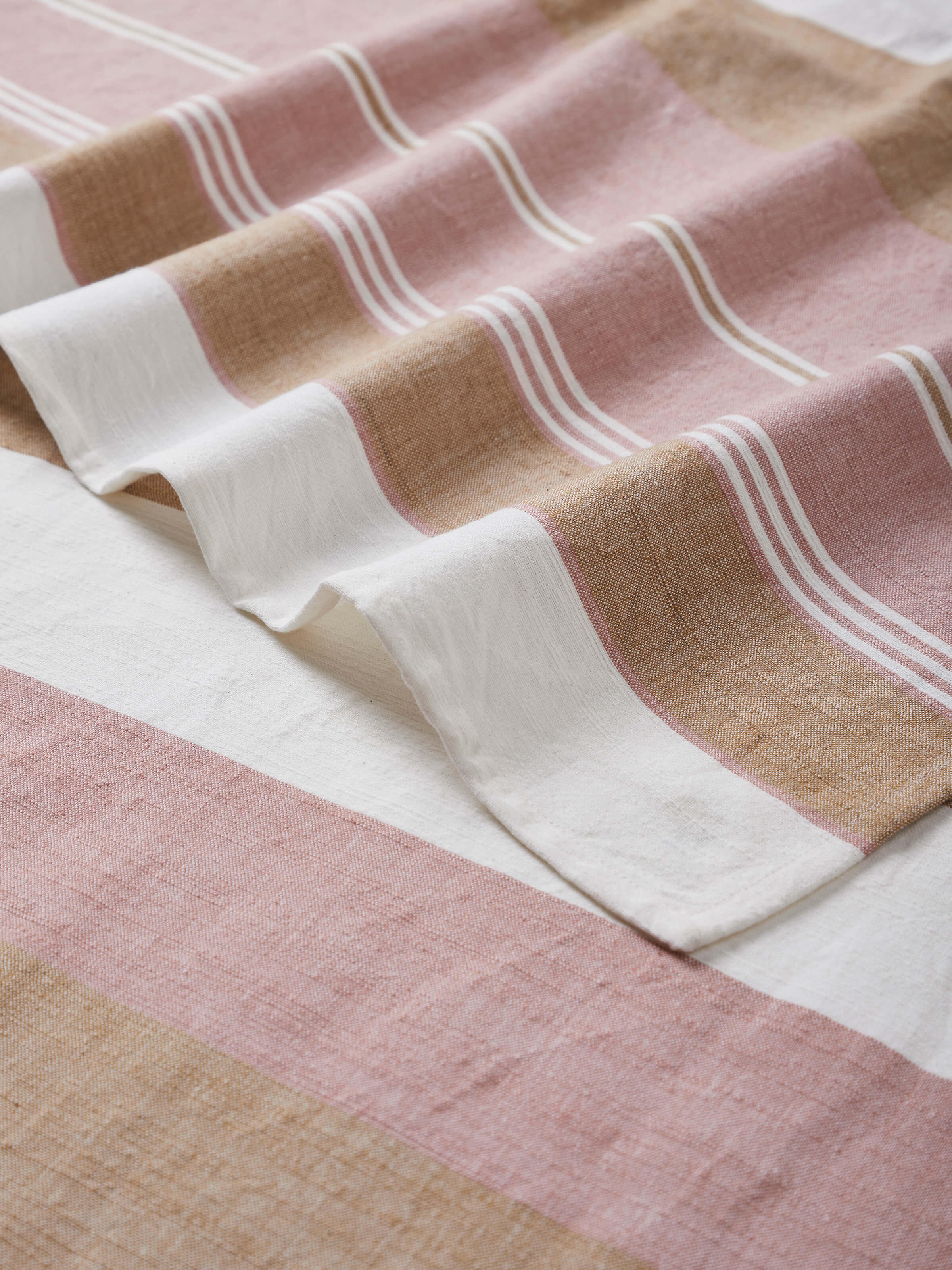 Back view of Aishani maroon stripe cotton bath towel focusing on the towel's thickness and stitching