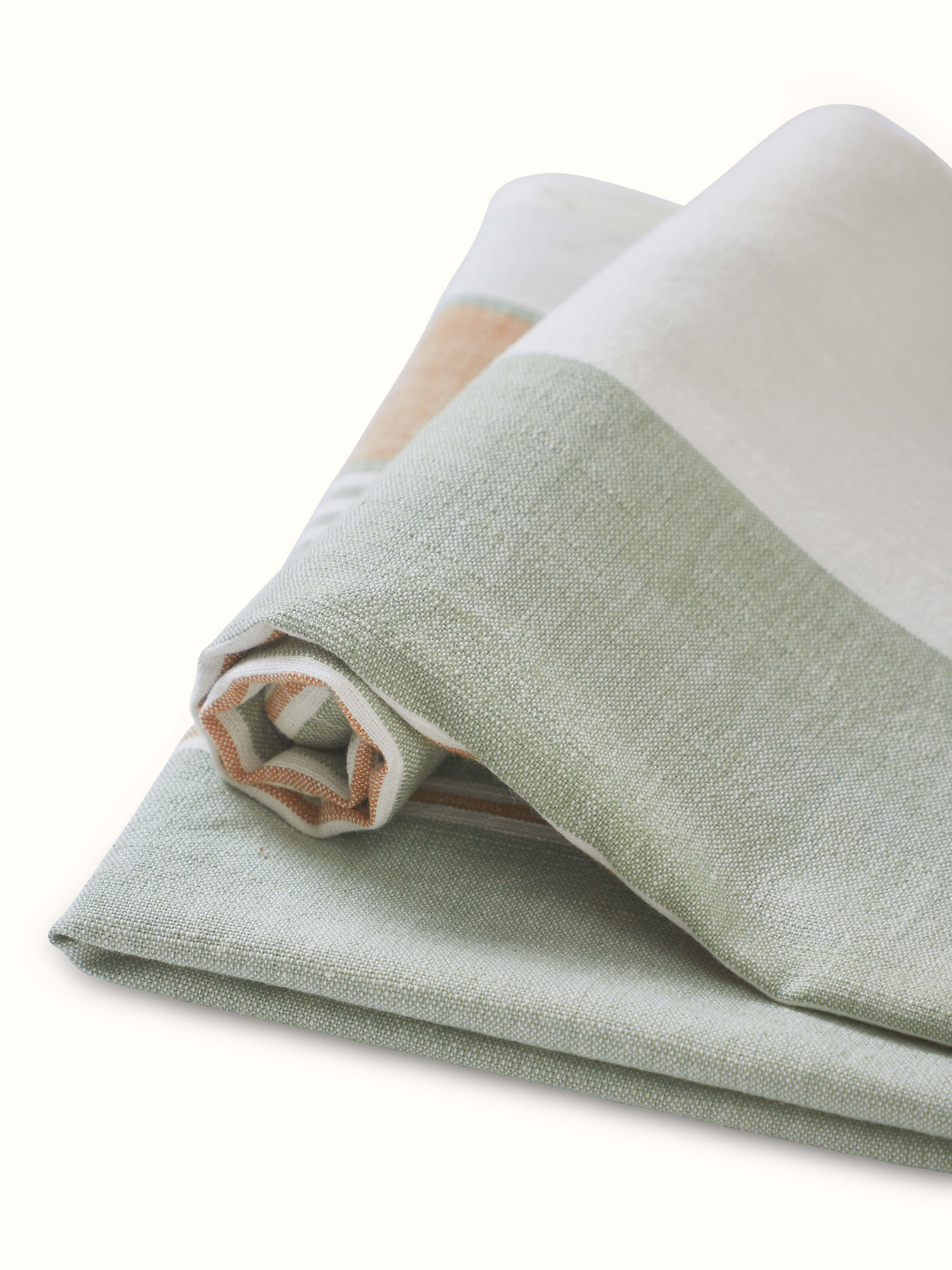 Detailed close-up of Aishani green stripe cotton hand towels highlighting the fabric's weave