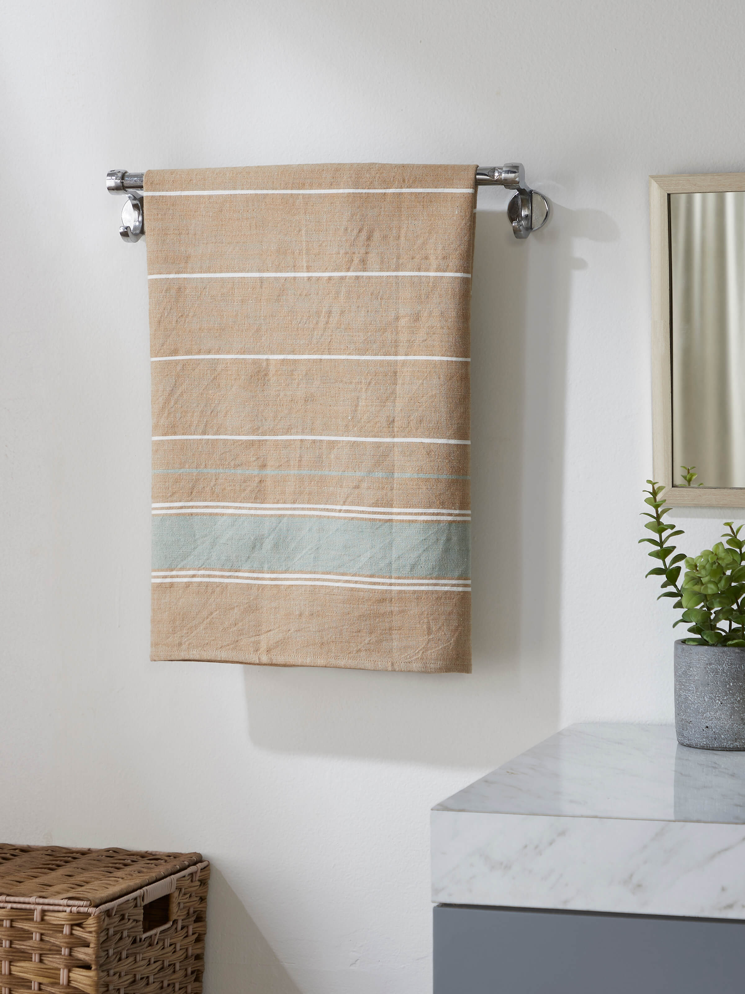 Close-up view of the green stripe cotton bath towel, focusing on the fabric's texture and stripe design.