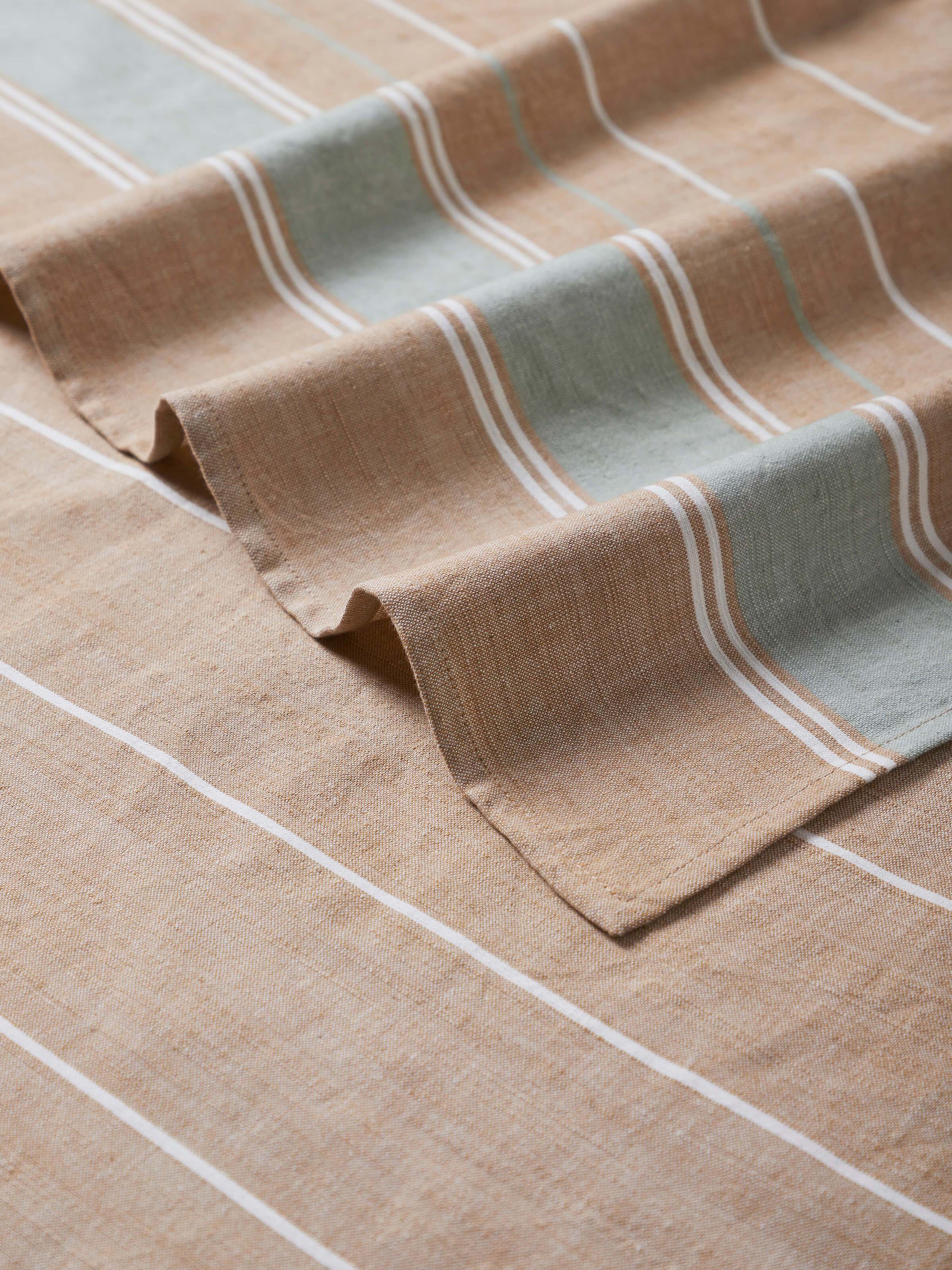 Side view of the green stripe cotton bath towel, showing the edge and overall design, emphasizing its quality and craftsmanship.