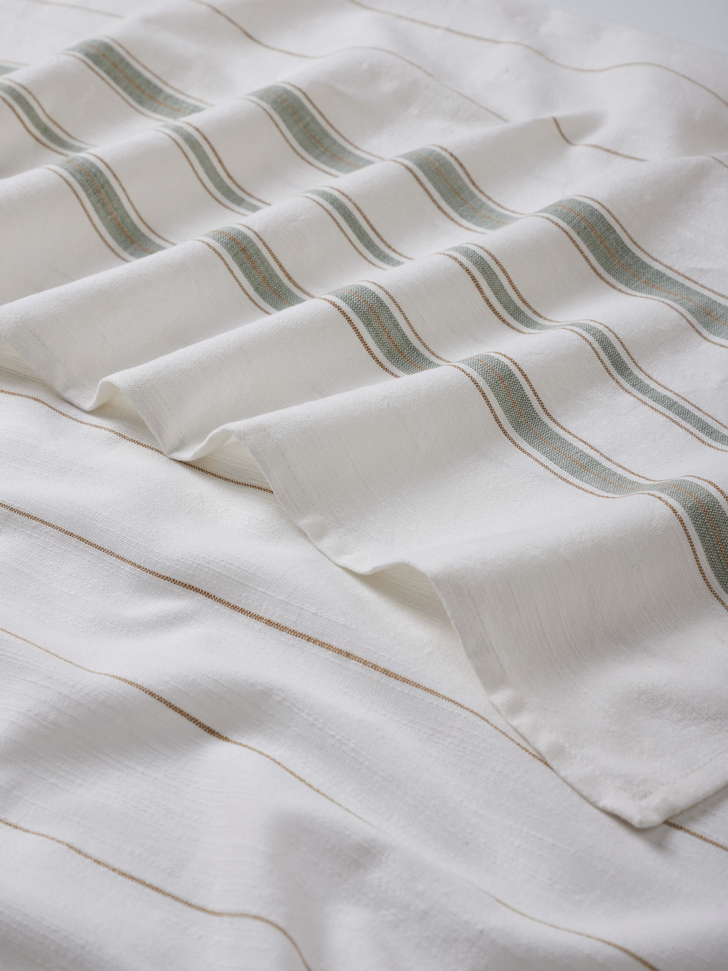 Detailed view of Adrita Green Stripe Cotton Bath Towel (M), focusing on the fabric's quality and stripe design.
