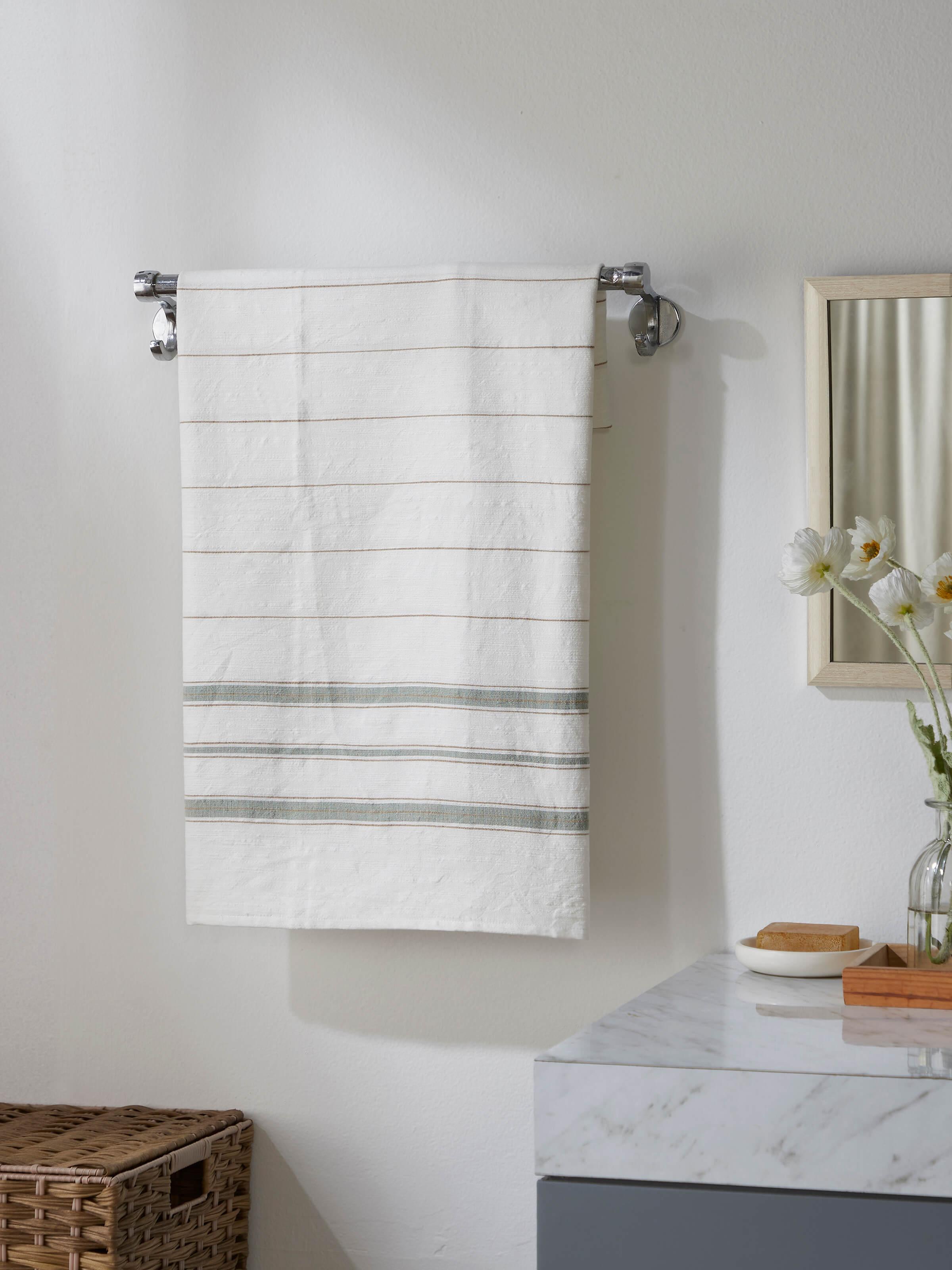 Close-up view of Adrita green cotton bath towel highlighting the striped pattern