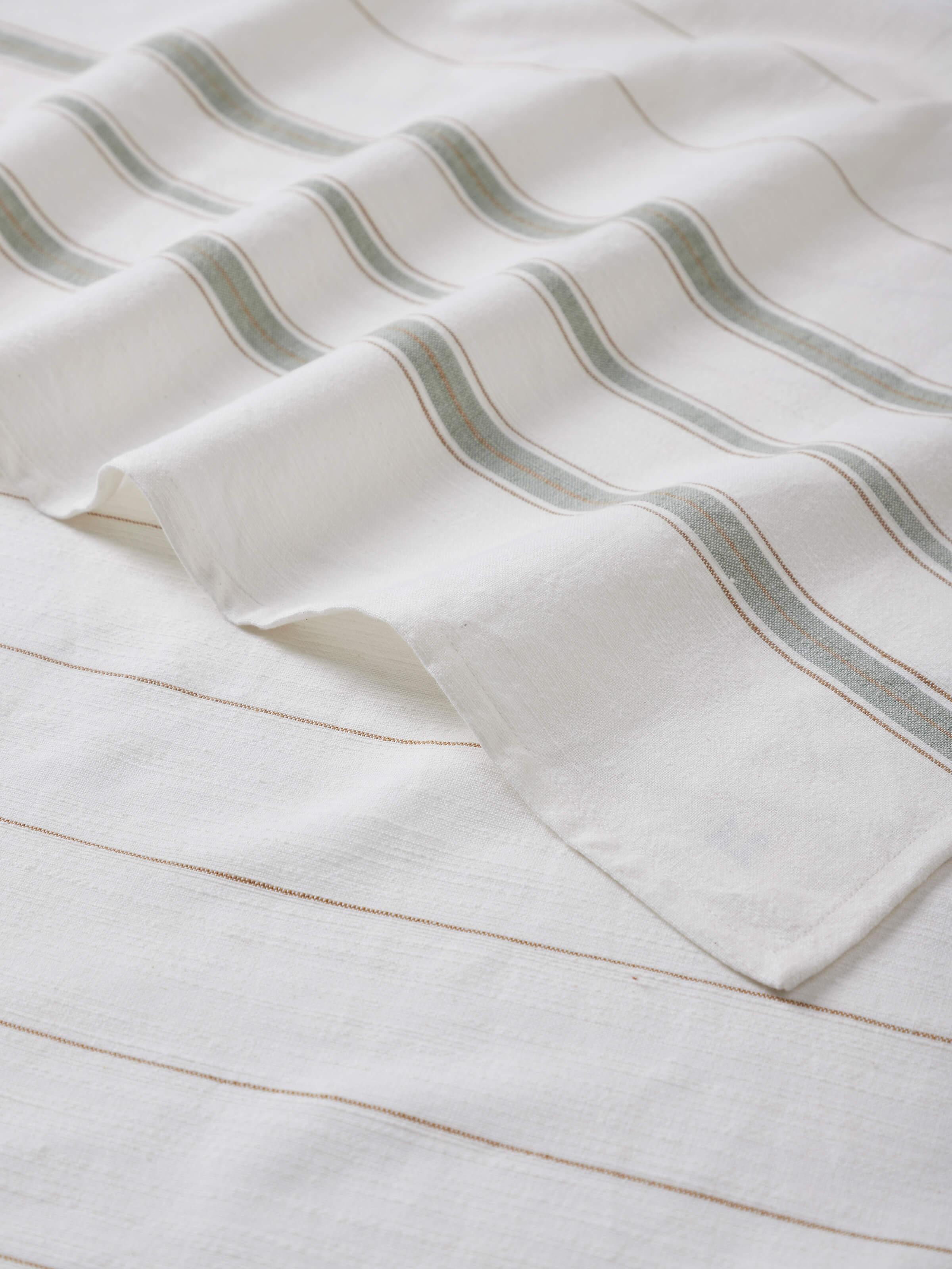 Full view of Adrita green cotton bath towel with striped design and soft fabric