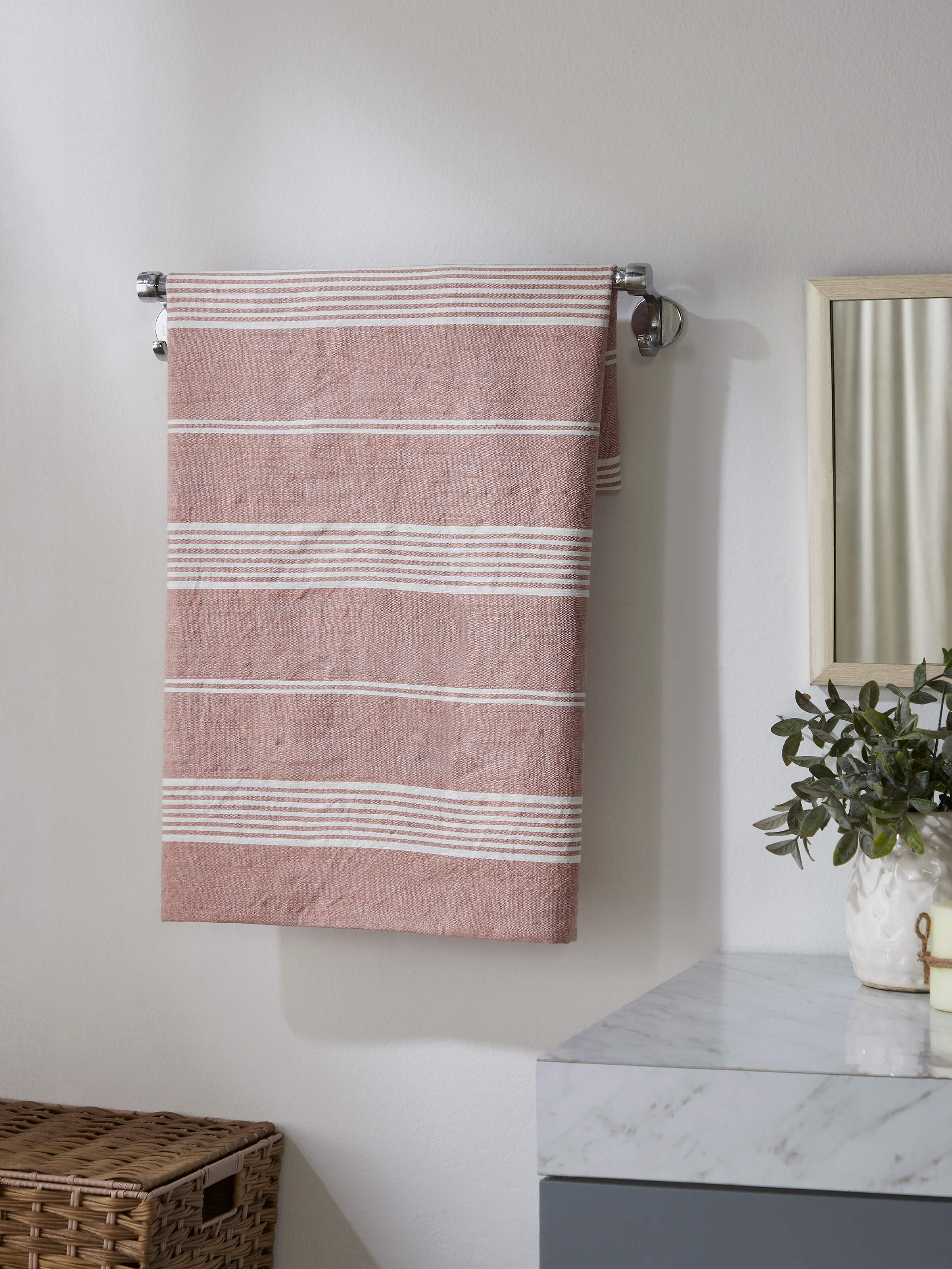 Side view of Simhi Pink Stripe Cotton Bath Towel (M), showcasing its pink and white stripe pattern.