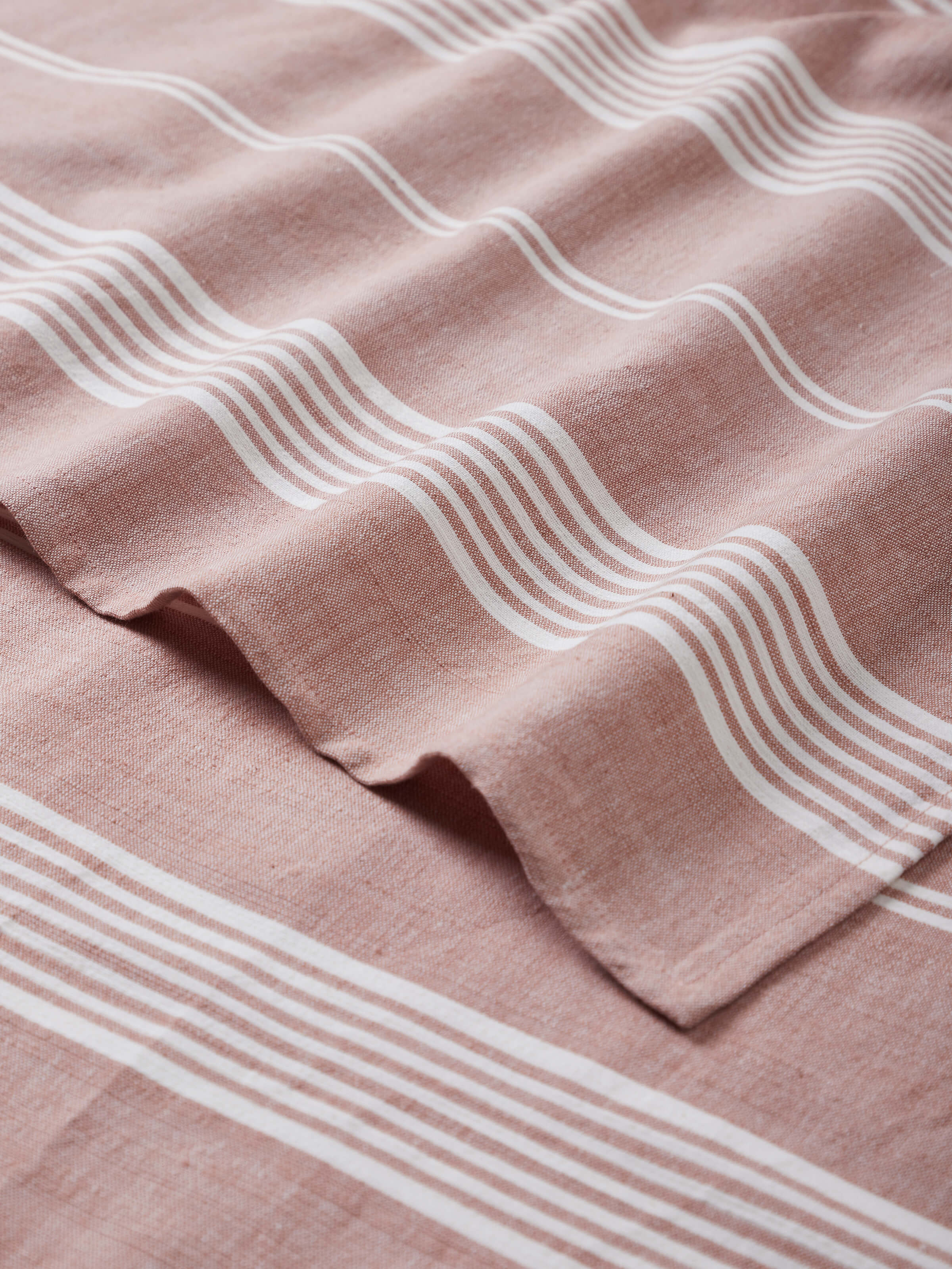 Close-up view of Simhi Pink Stripe Cotton Bath Towel (L) highlighting the striped pattern and fabric detail.