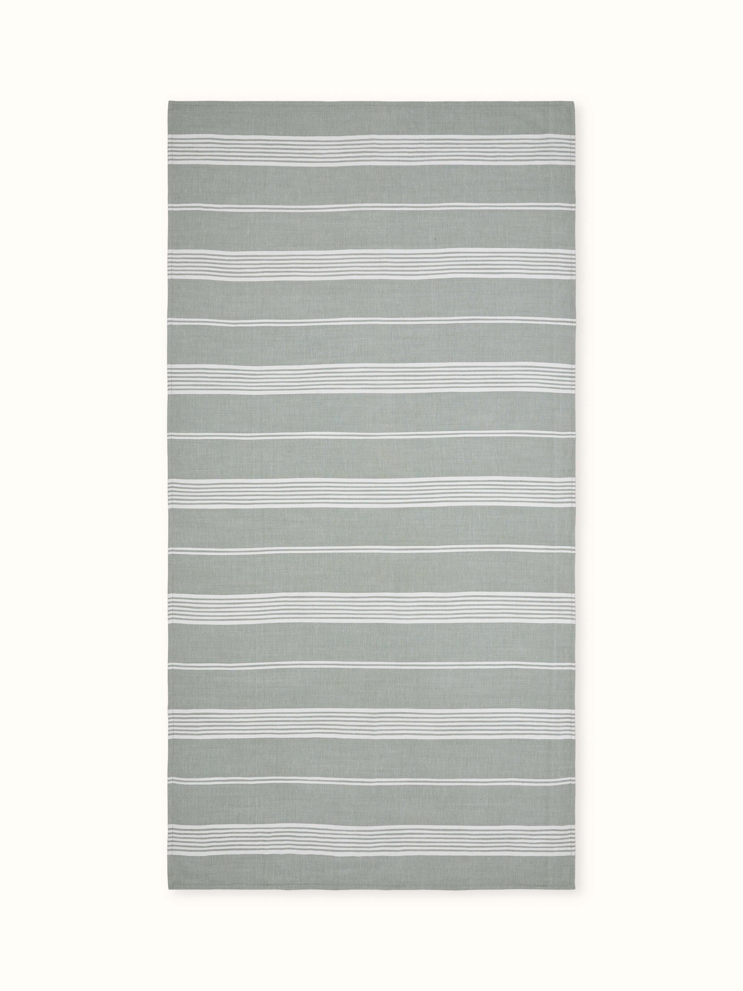 Simhi green striped cotton bath towel, showing the full length and the green stripe pattern.