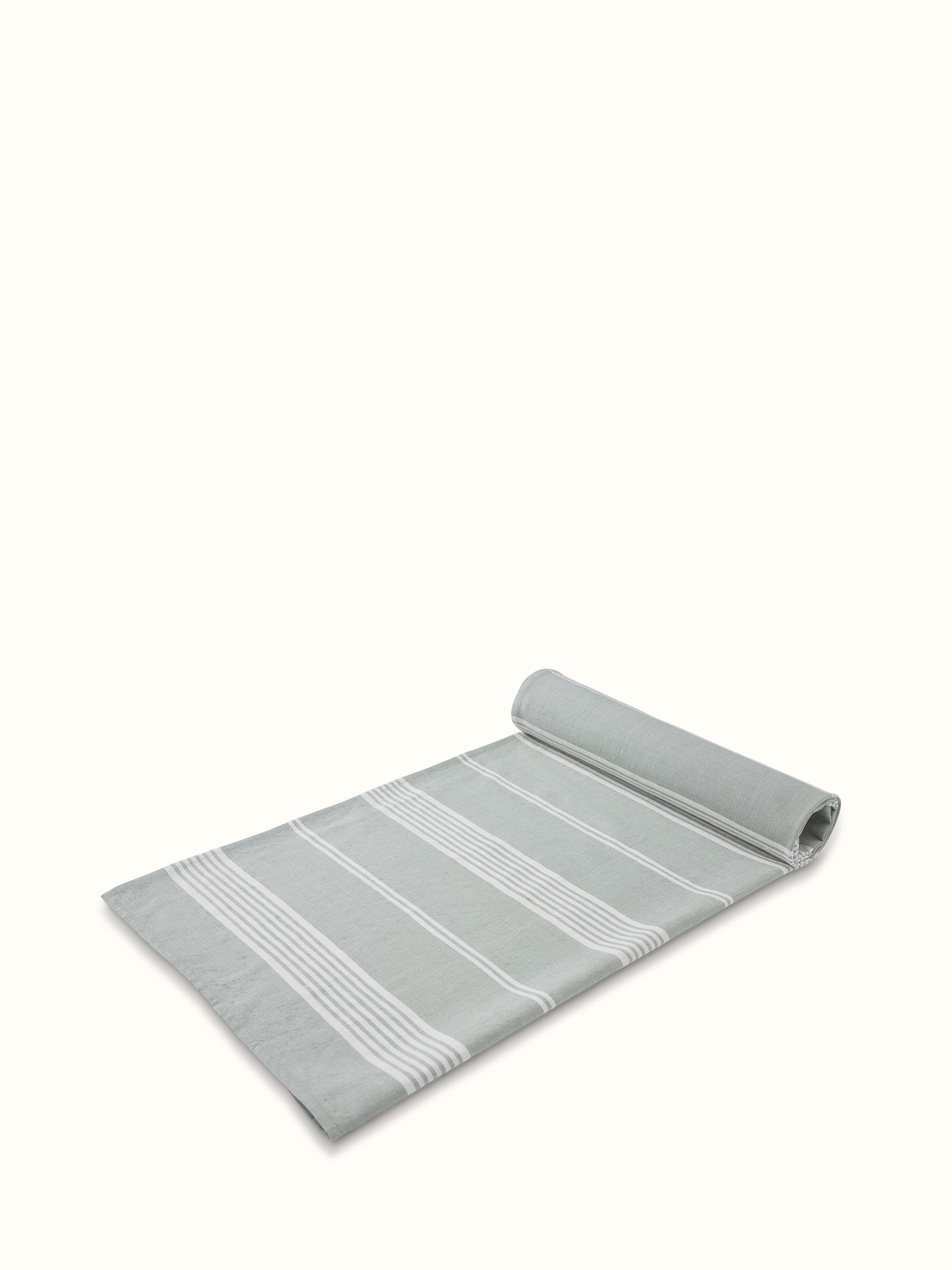 Full view of Simhi green striped cotton bath towel, displaying the length and the alternating green stripes