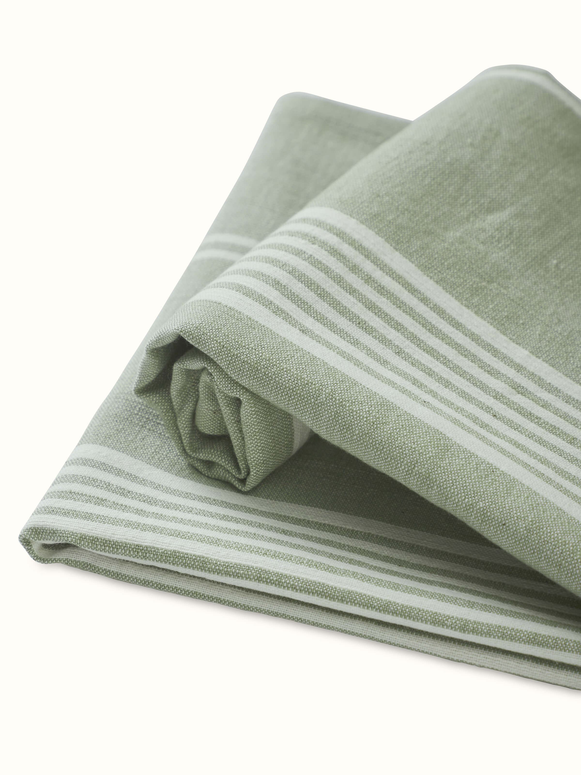 Simhi green stripe cotton hand towels displayed in a bathroom setting, showcasing their practical use and design.