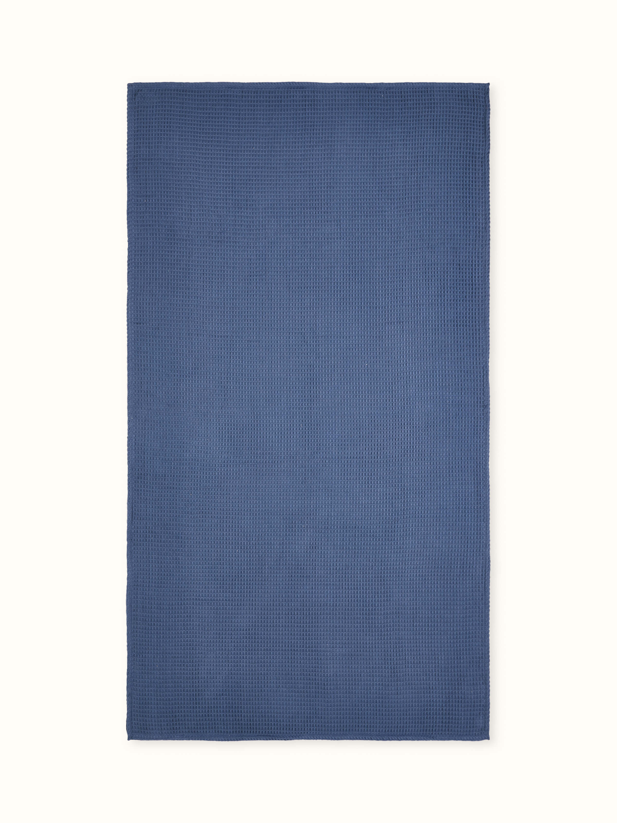 Close-up view of Amala Waffle Blue Solid Cotton Bath Towel showcasing the waffle texture.