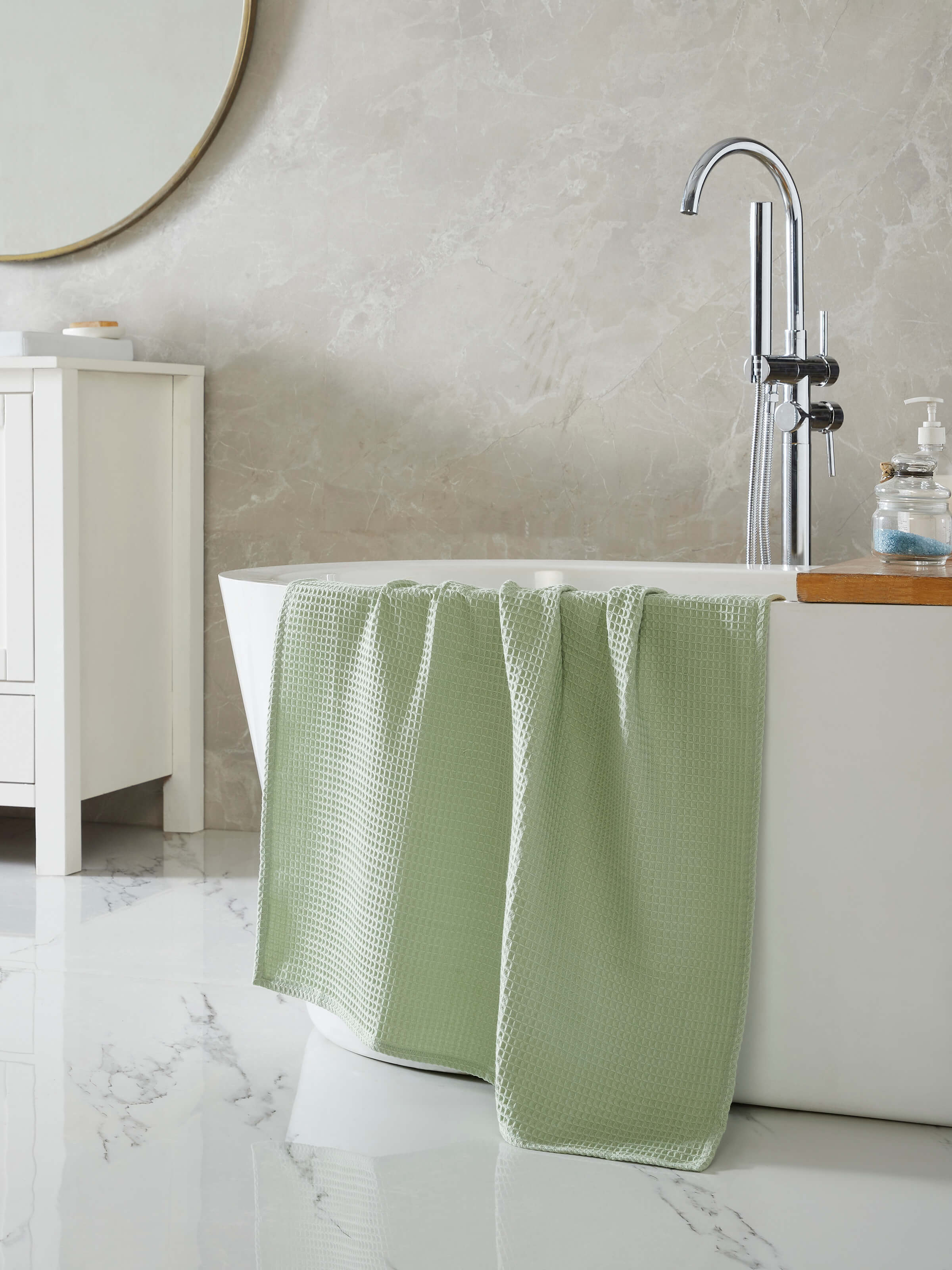 Close-up view of Amala waffle green solid cotton bath towel (M), emphasizing the waffle weave and fabric detail.