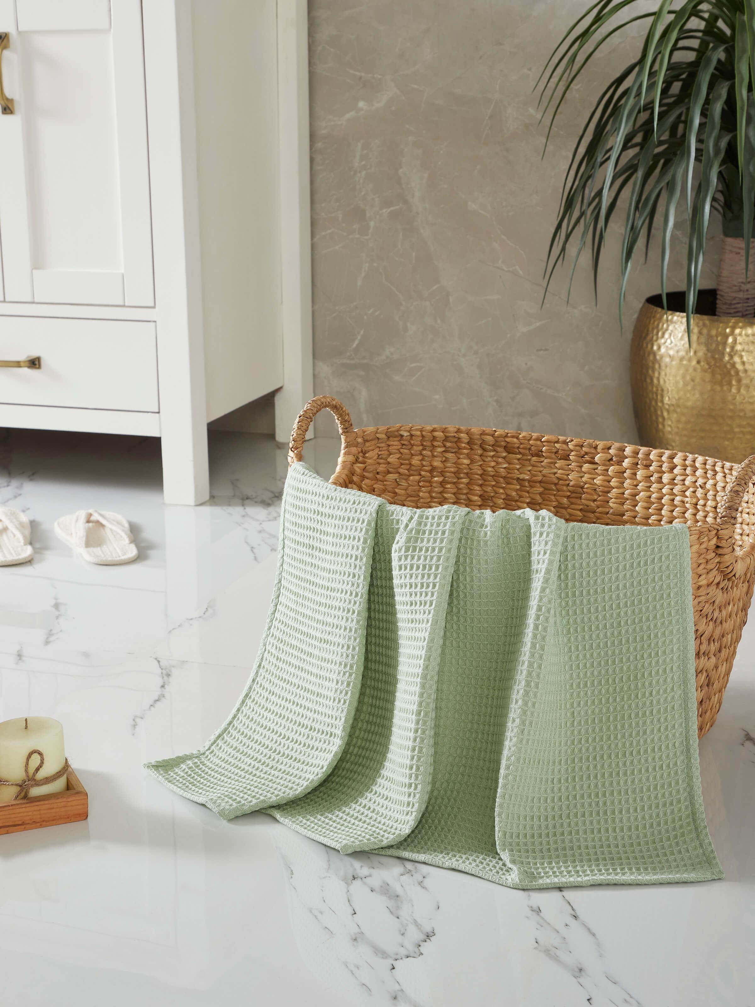Close-up view of Amala waffle green solid cotton bath towel highlighting its unique waffle pattern and plush texture