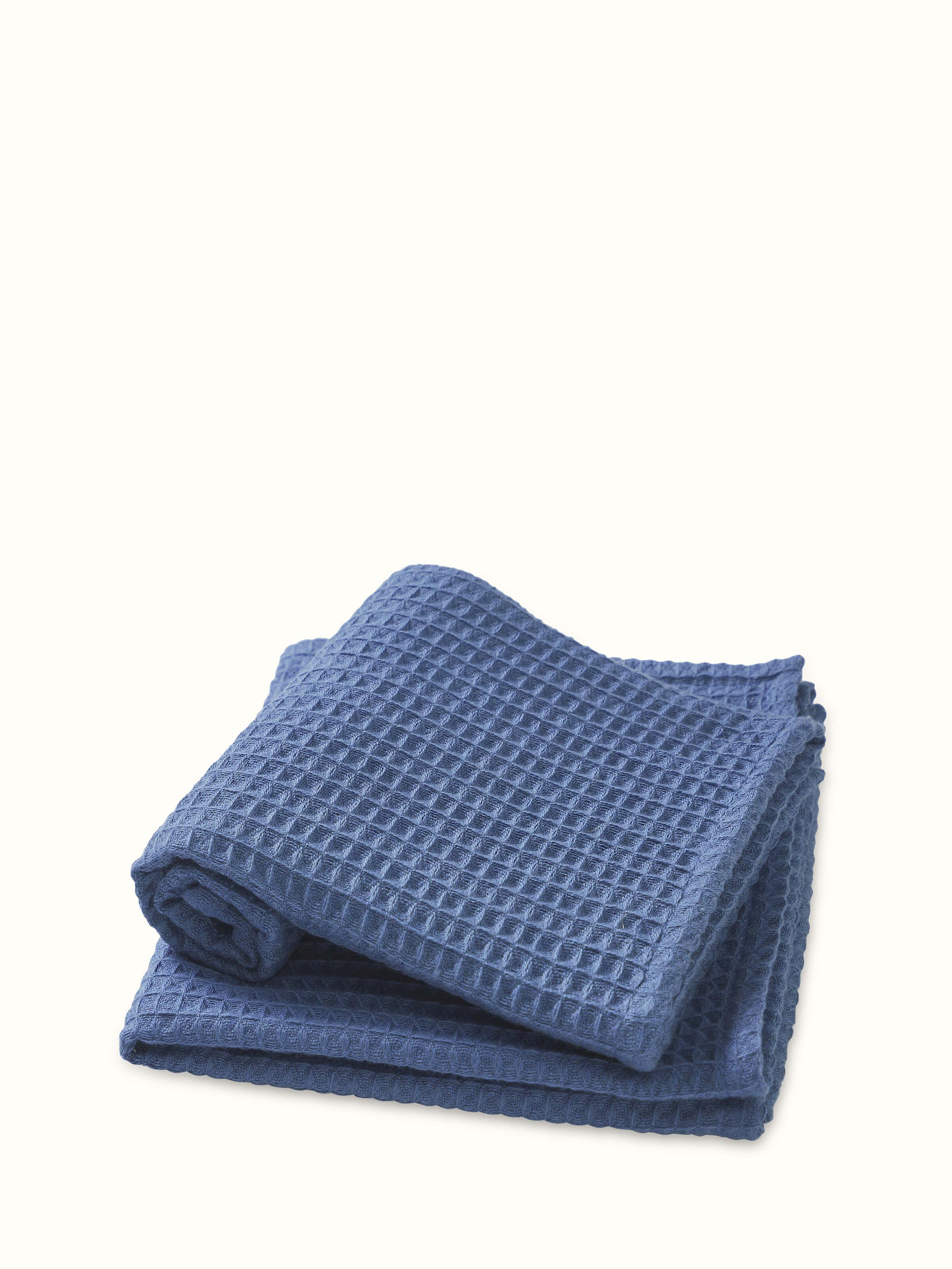 Amala blue waffle cotton hand towels, displaying the textured waffle weave pattern and solid color.