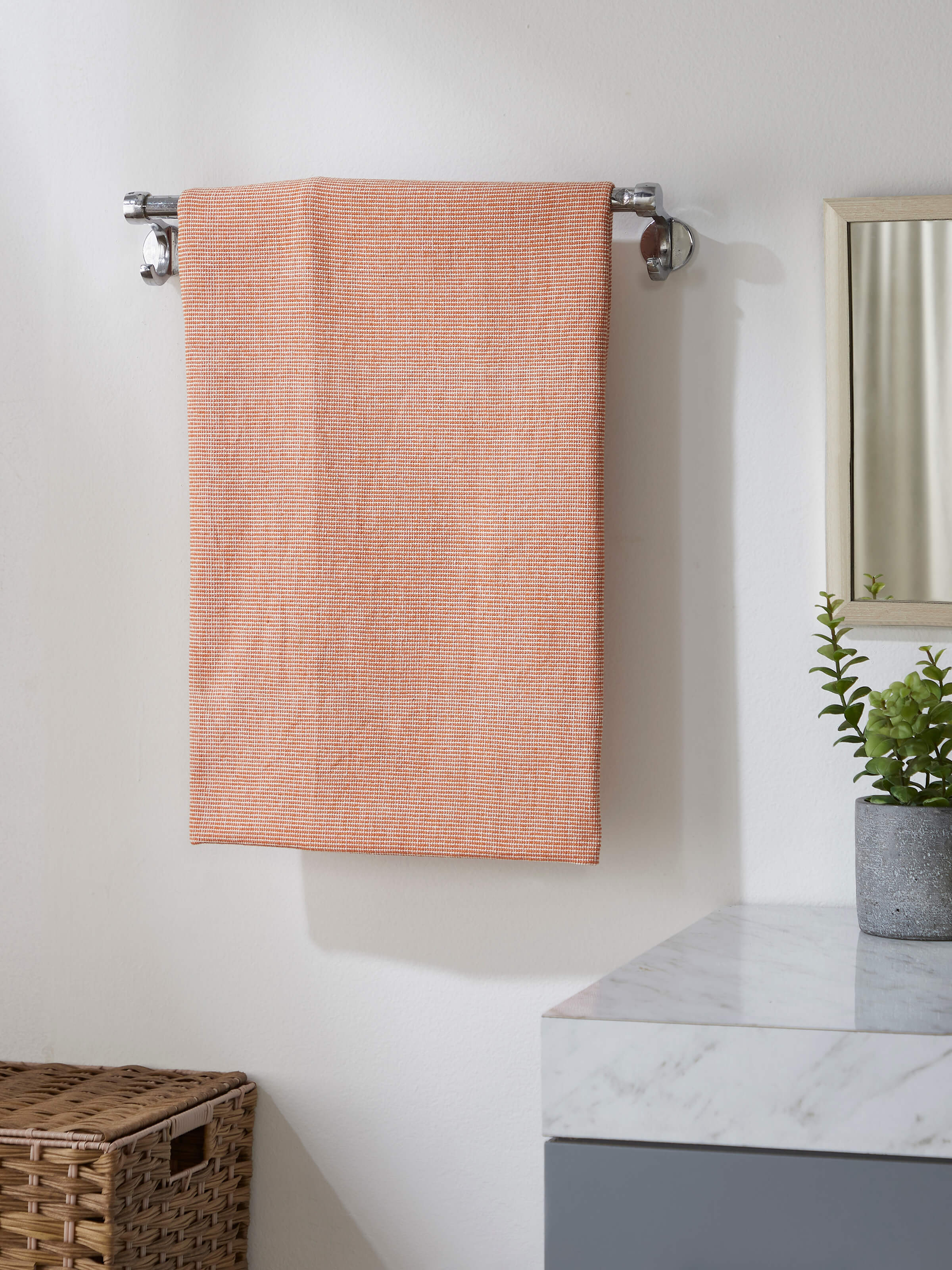 Close-up of Shikara Brown Chambray Cotton Bath Towel (L) highlighting the chambray weave and absorbent fabric