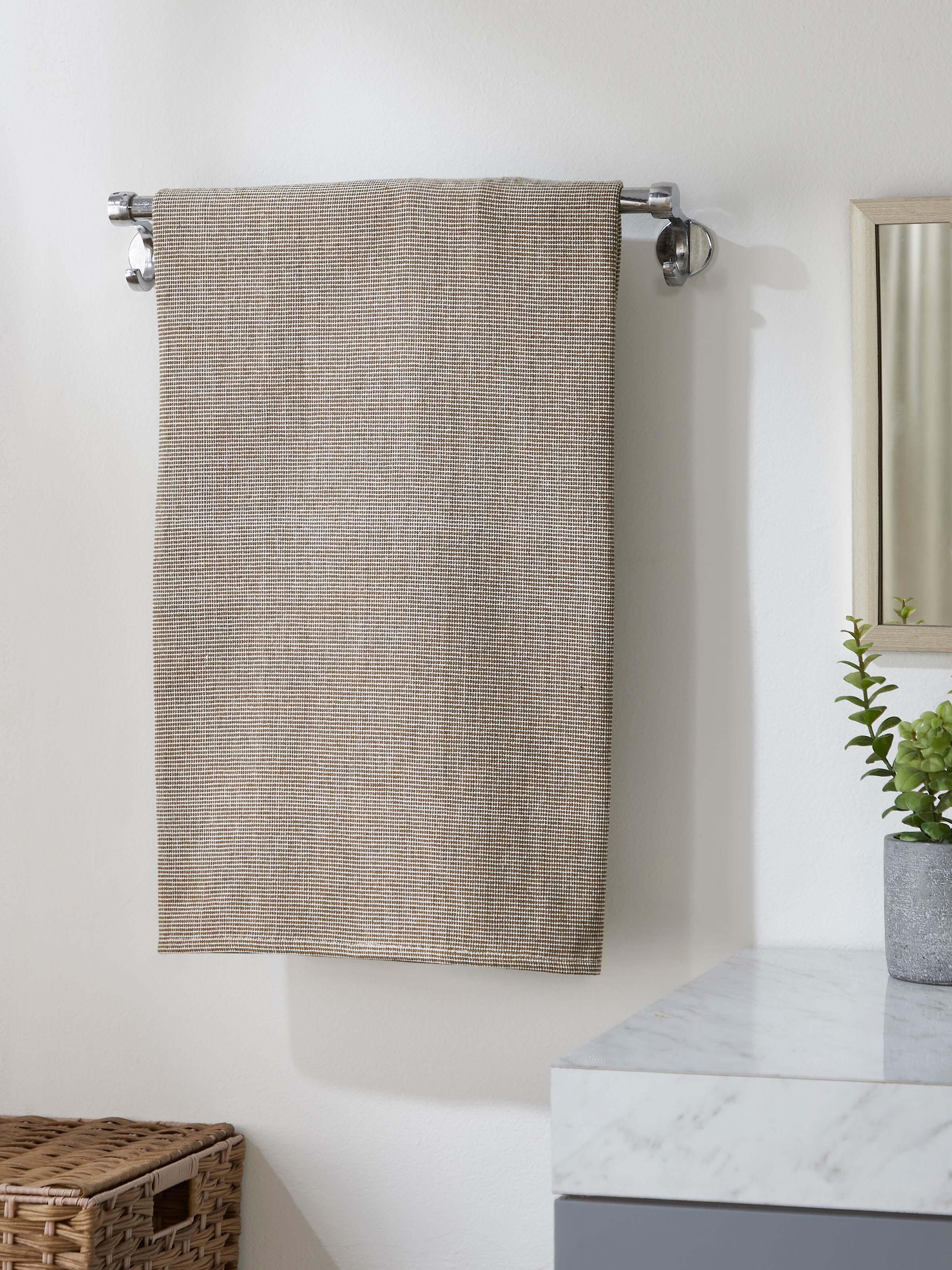 Close-up of Shikara green chambray cotton bath towel (L) highlighting the chambray texture and green color