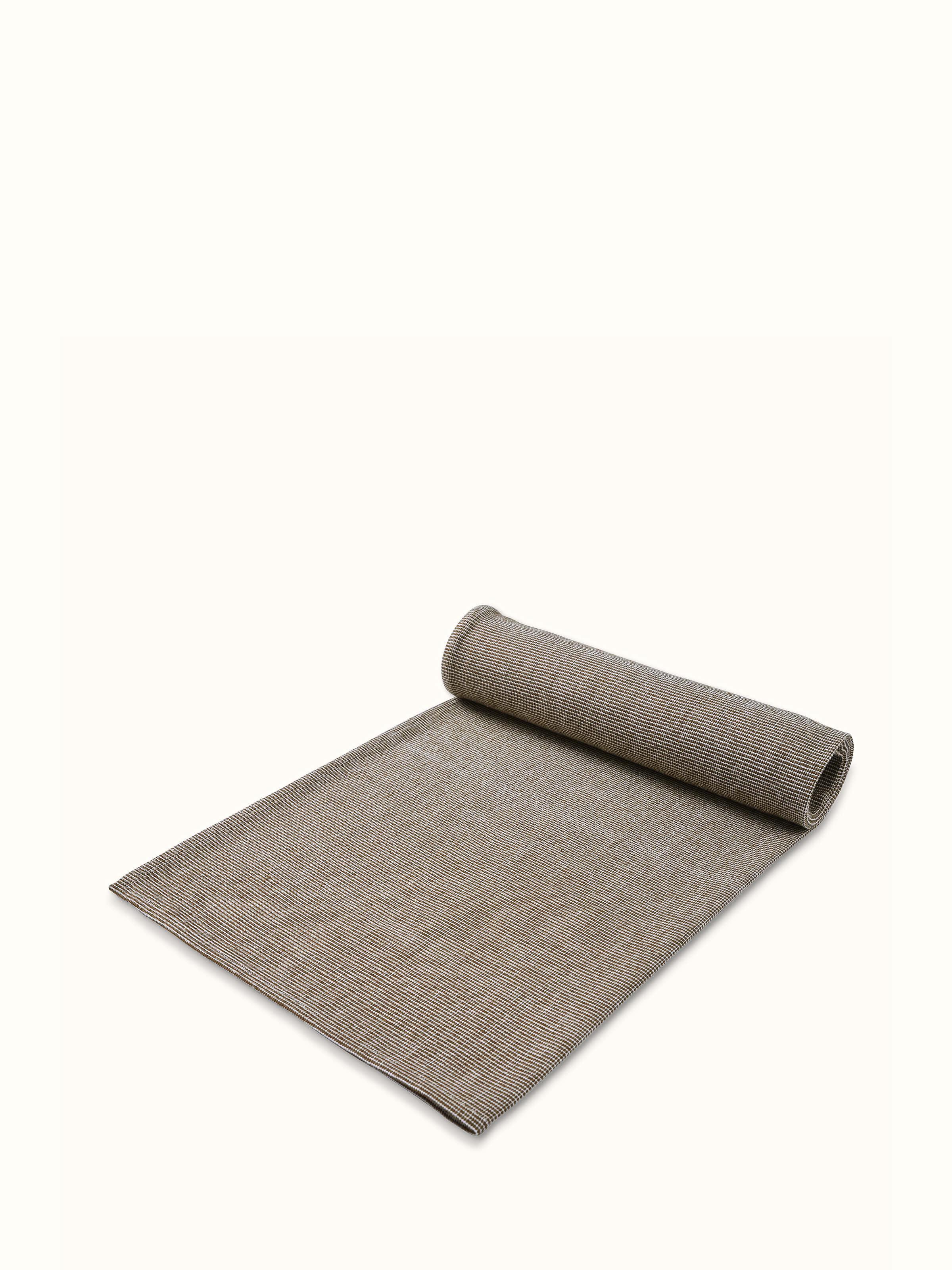 Full view of Shikara green chambray cotton bath towel (L) displayed to show its size, texture, and green chambray fabric