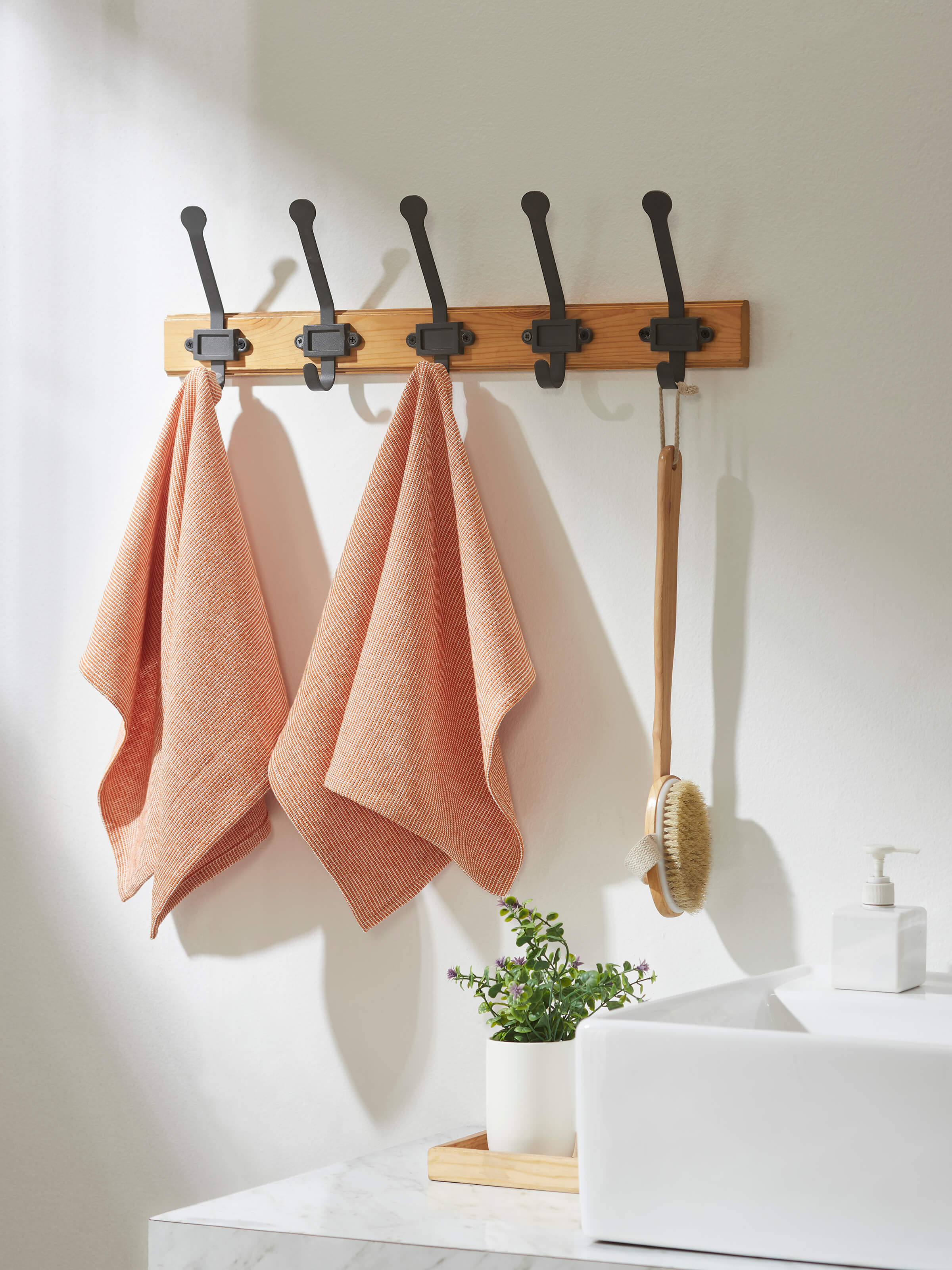 Close-up view of Shikara rust chambray cotton hand towels (2 pcs) highlighting the chambray weave and rust color.