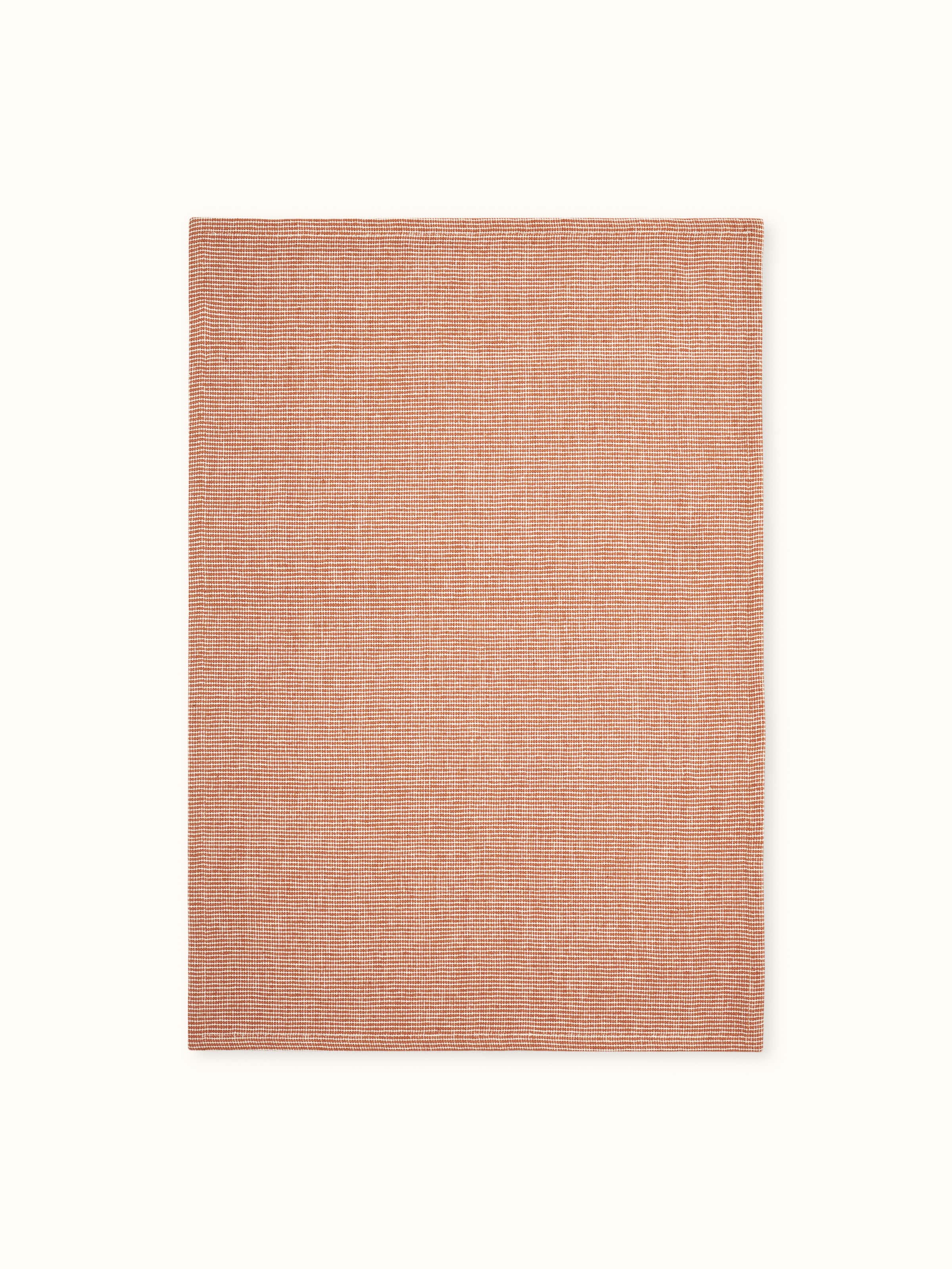 Detailed close-up of Shikara rust chambray cotton hand towels (2 pcs) showing the texture and color of the chambray fabric.