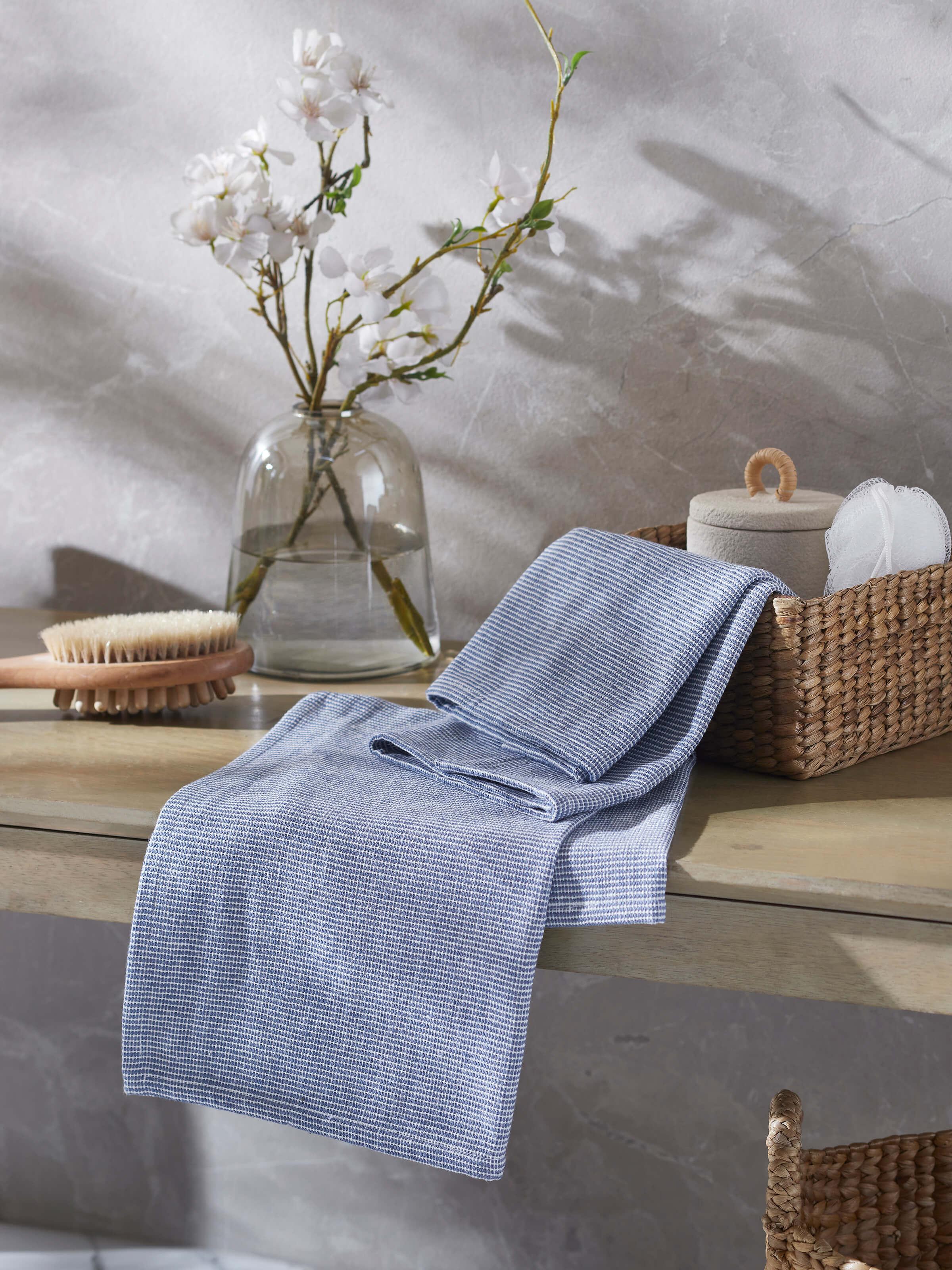 Close-up of Shikara blue chambray cotton hand towels (2 pcs) highlighting the chambray texture and blue color shade