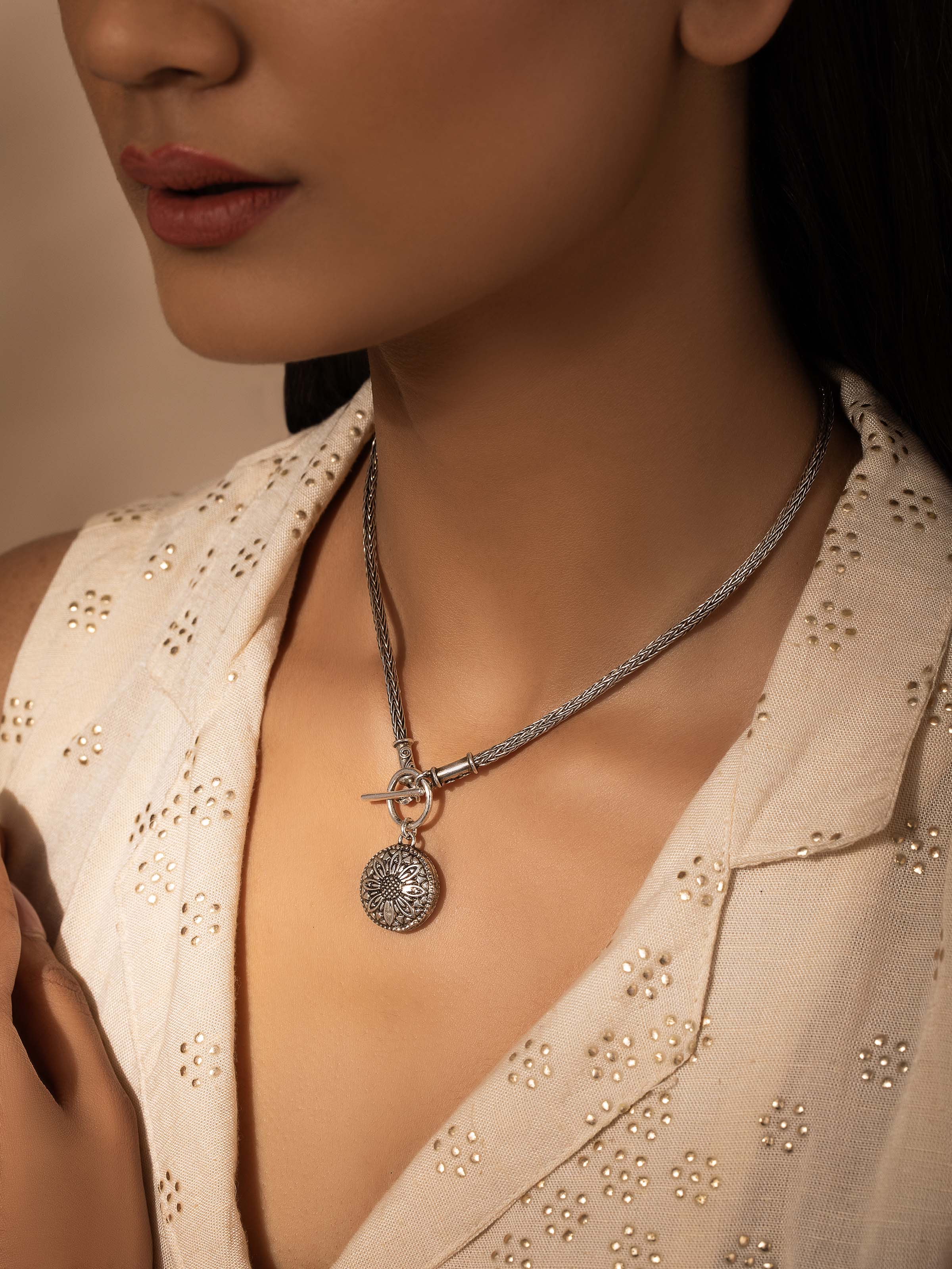 Close-up view of Silver Collar Necklace highlighting the smooth metal surface and elegant design.