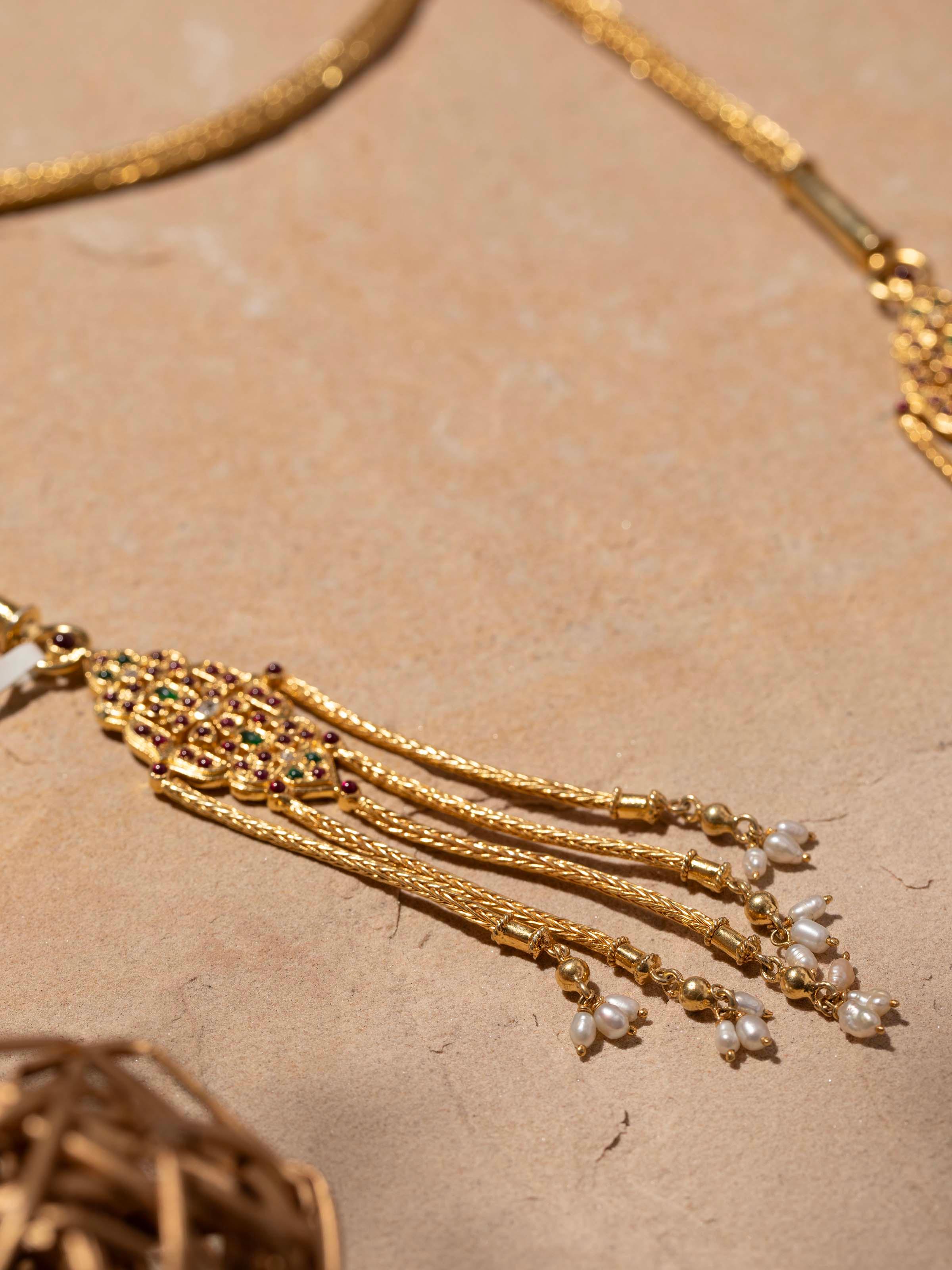 Detailed view of Silver long necklace highlighting its intricate design and polished finish.