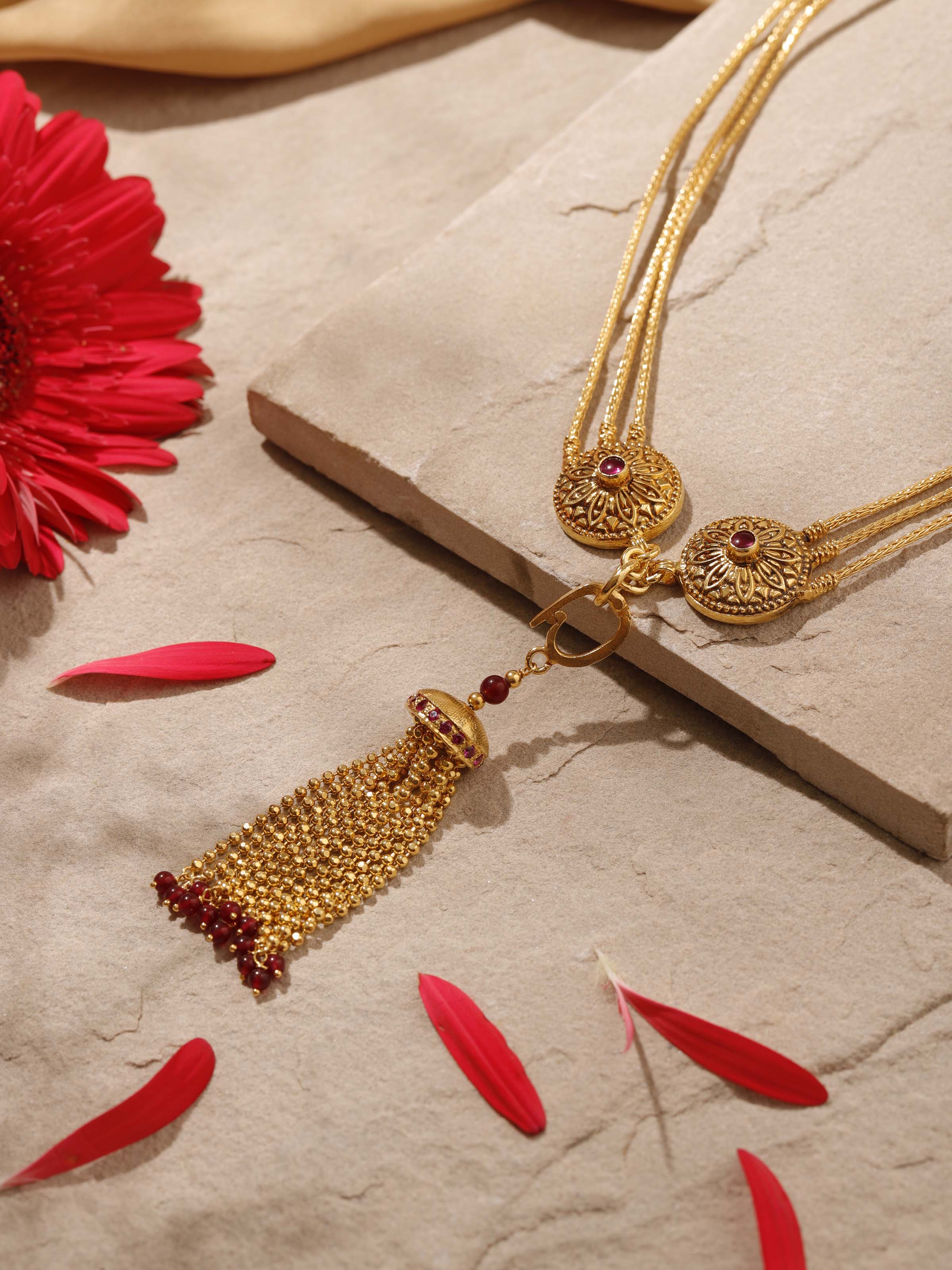 Angled view of silver long necklace showcasing its elegant design and detailed metalwork