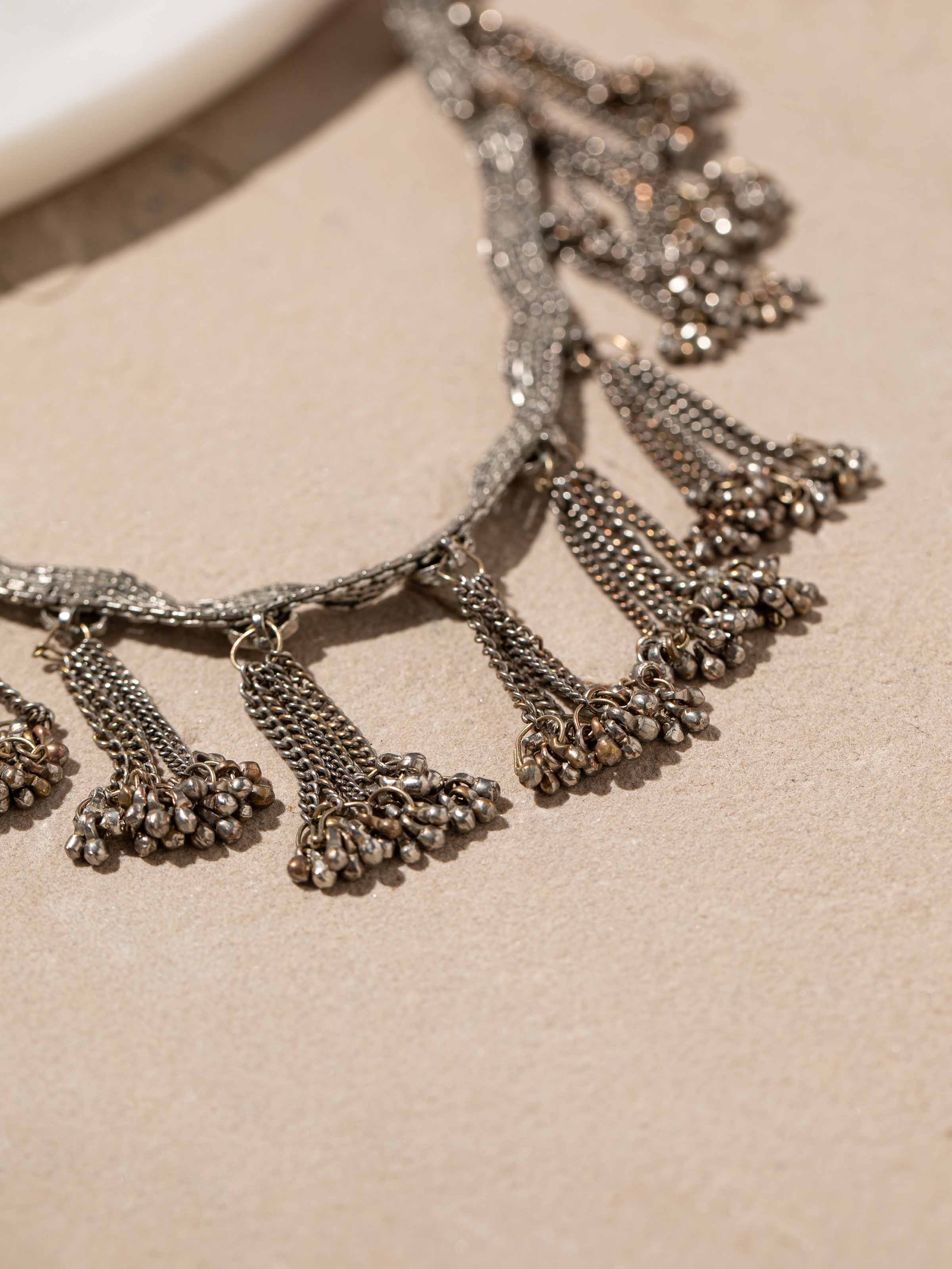 Detailed view of Tribal Silver Collar Necklace focusing on intricate silverwork.