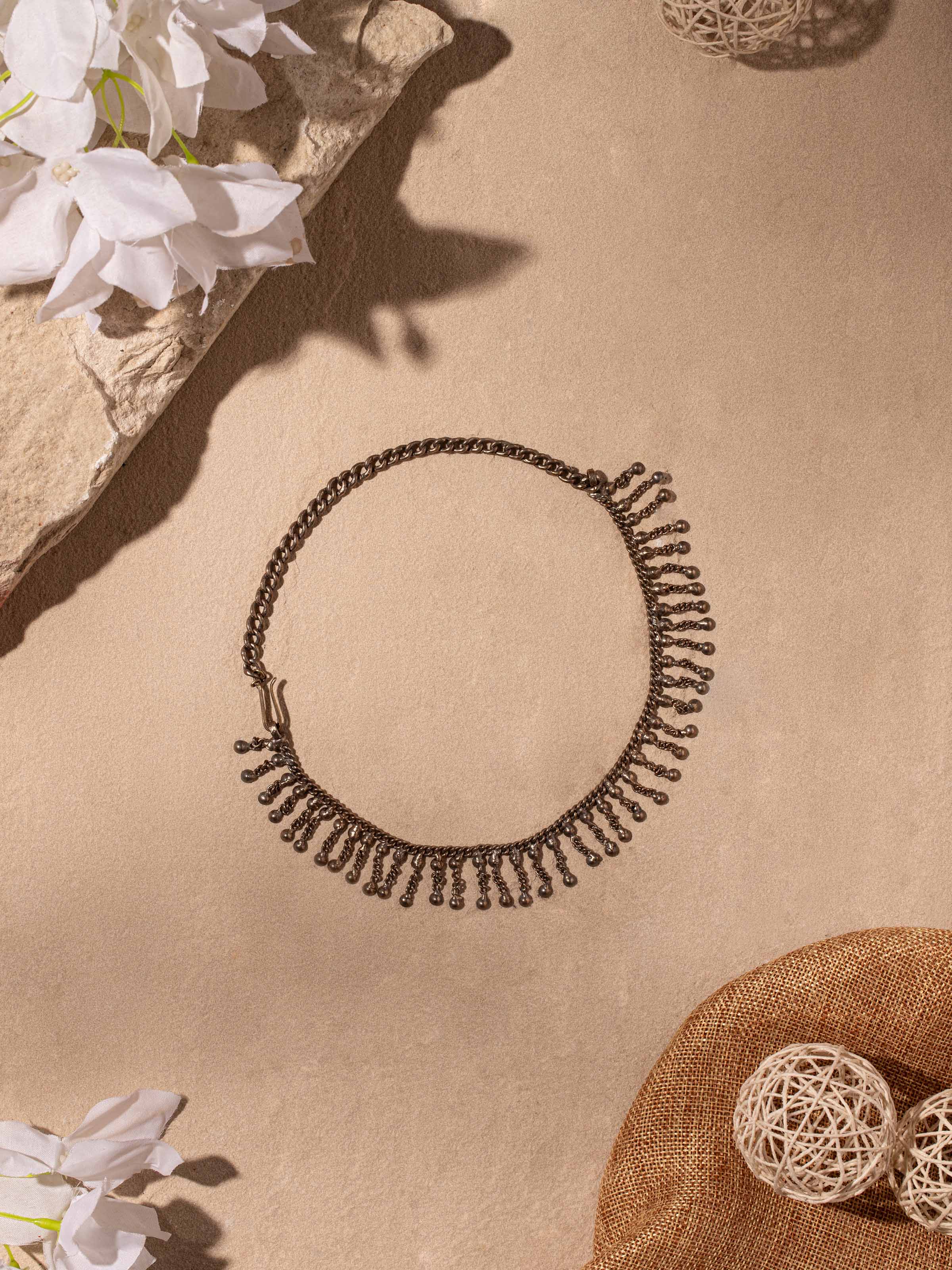 Side view of Tribal Silver Collar Necklace by Swadesh highlighting the sculptural silver design and smooth texture