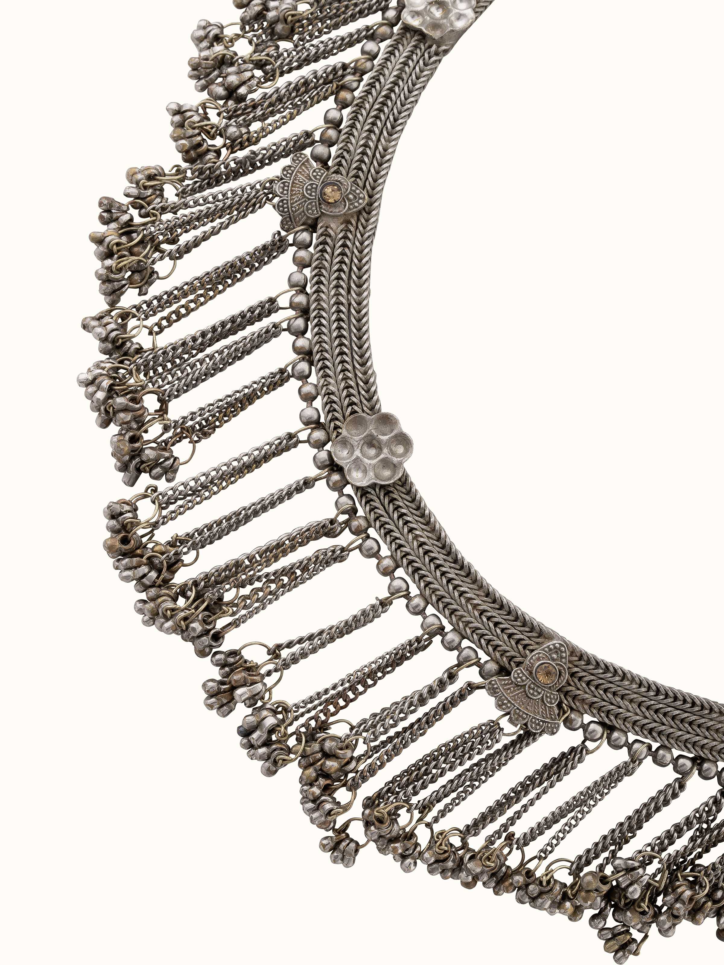 Angled view of Tribal Silver collar necklace showcasing its elaborate patterns and fine silverwork