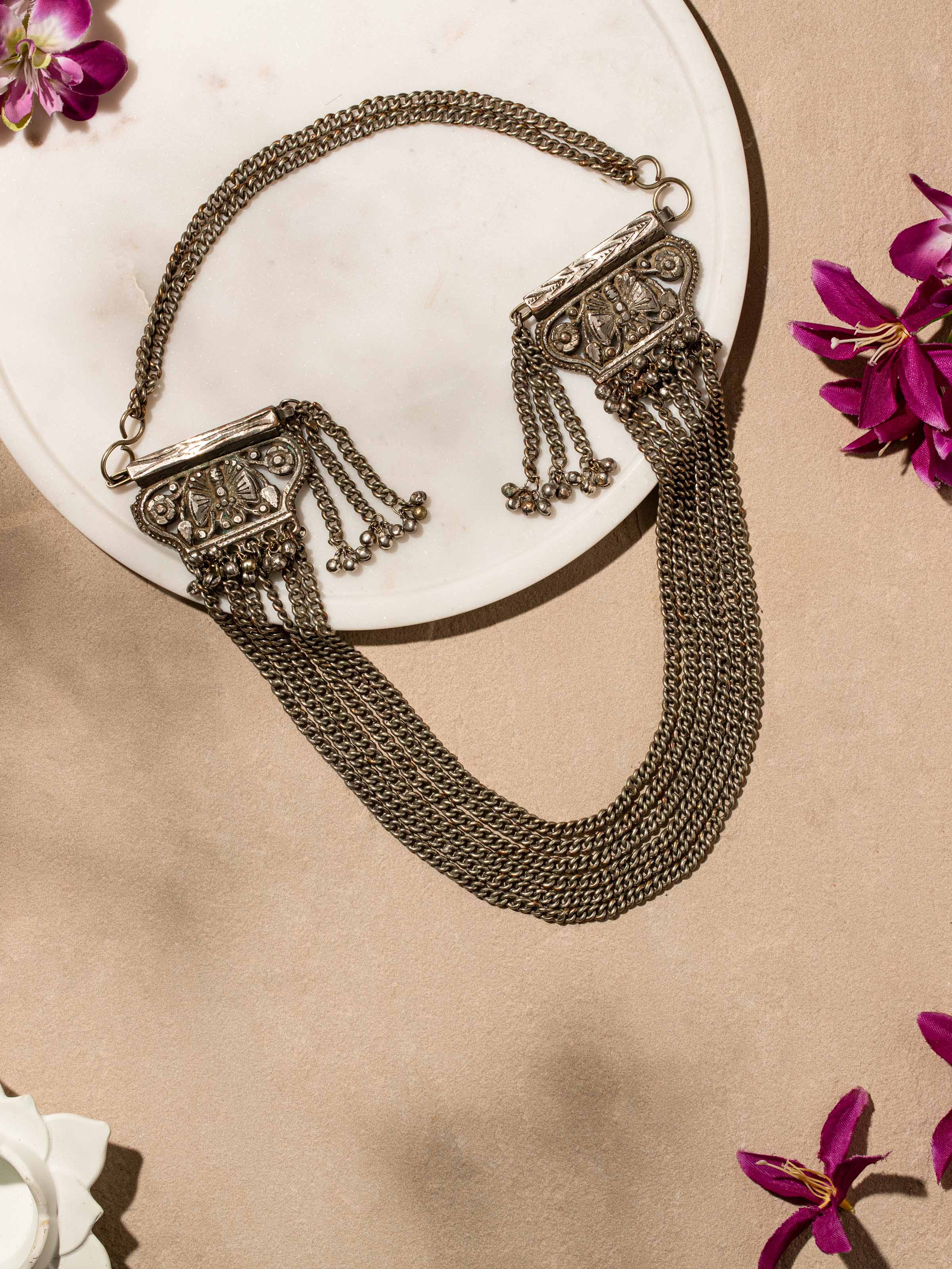 Side view of Tribal Silver Long Necklace emphasizing its length and intricate tribal design.