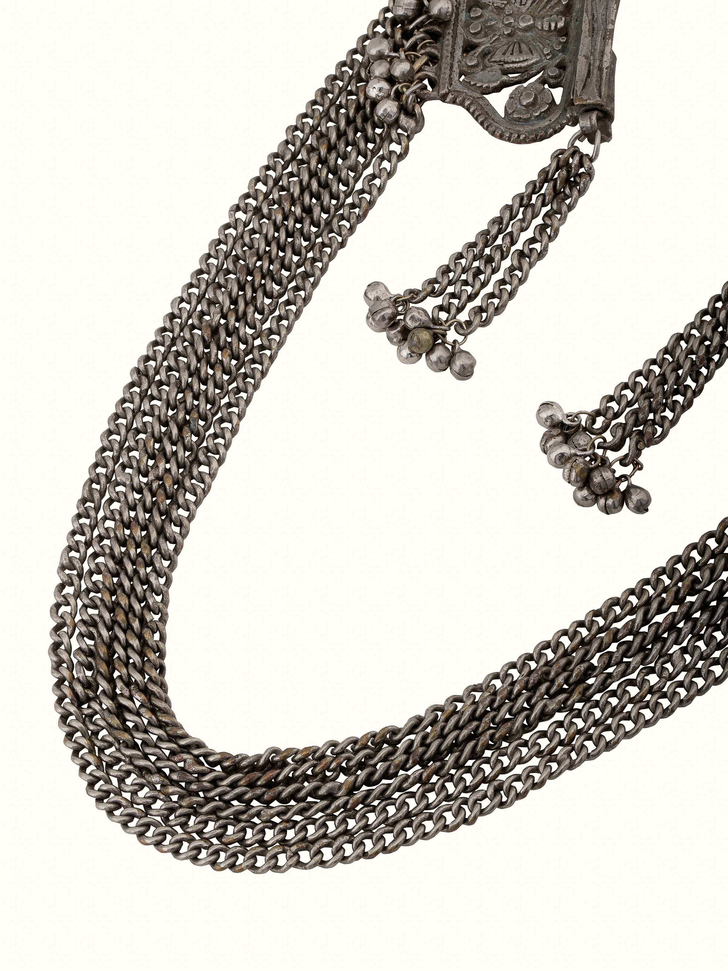 Angled view of Tribal Silver Long Necklace showcasing the detailed silverwork and traditional style.