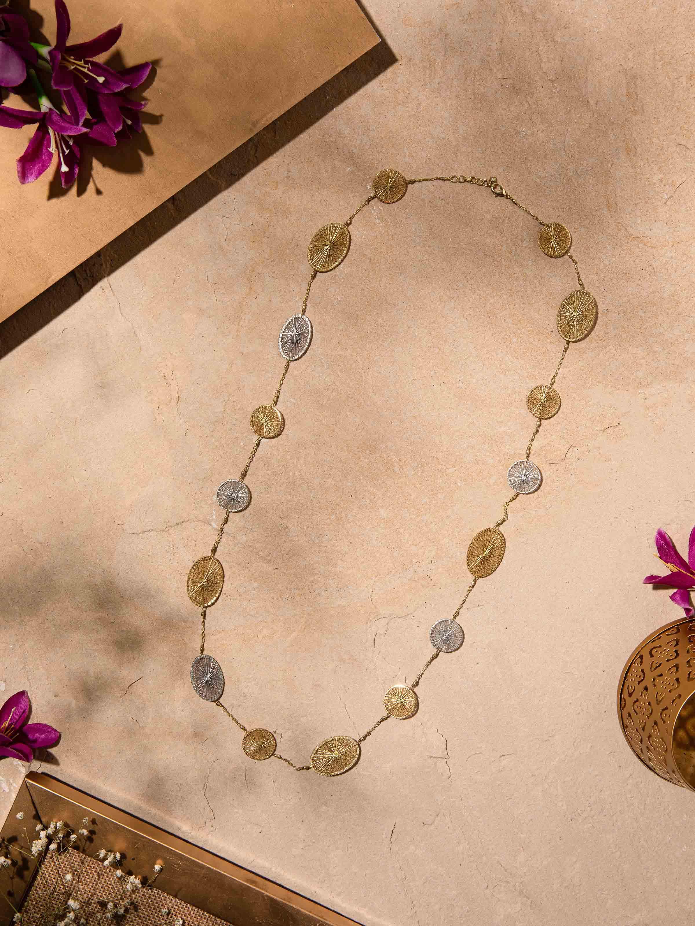 Close-up view of String Craft Long Necklace emphasizing the fine stringwork and intricate design