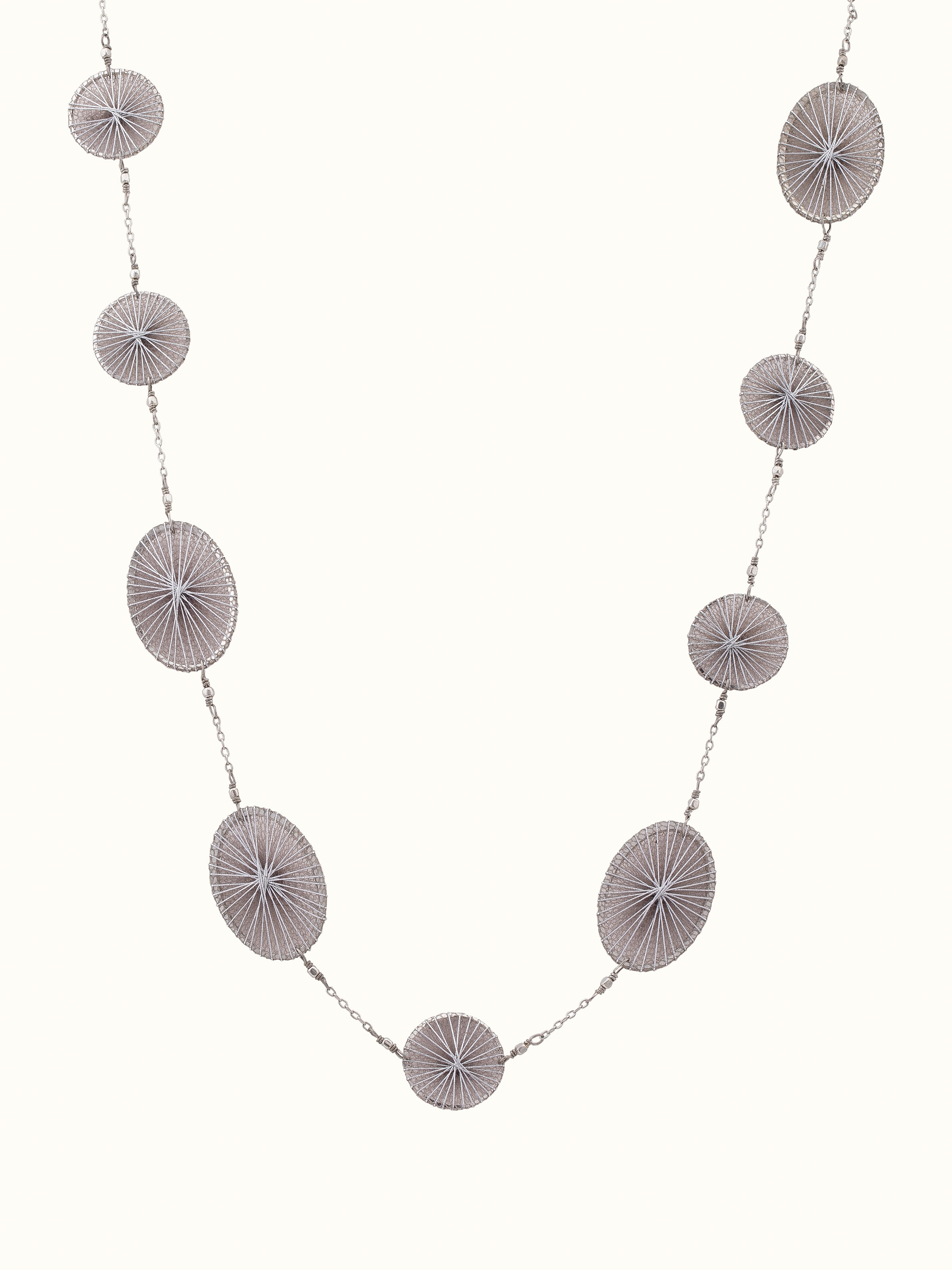 Front view of String Craft Long Necklace featuring colorful strings and intricate design elements.