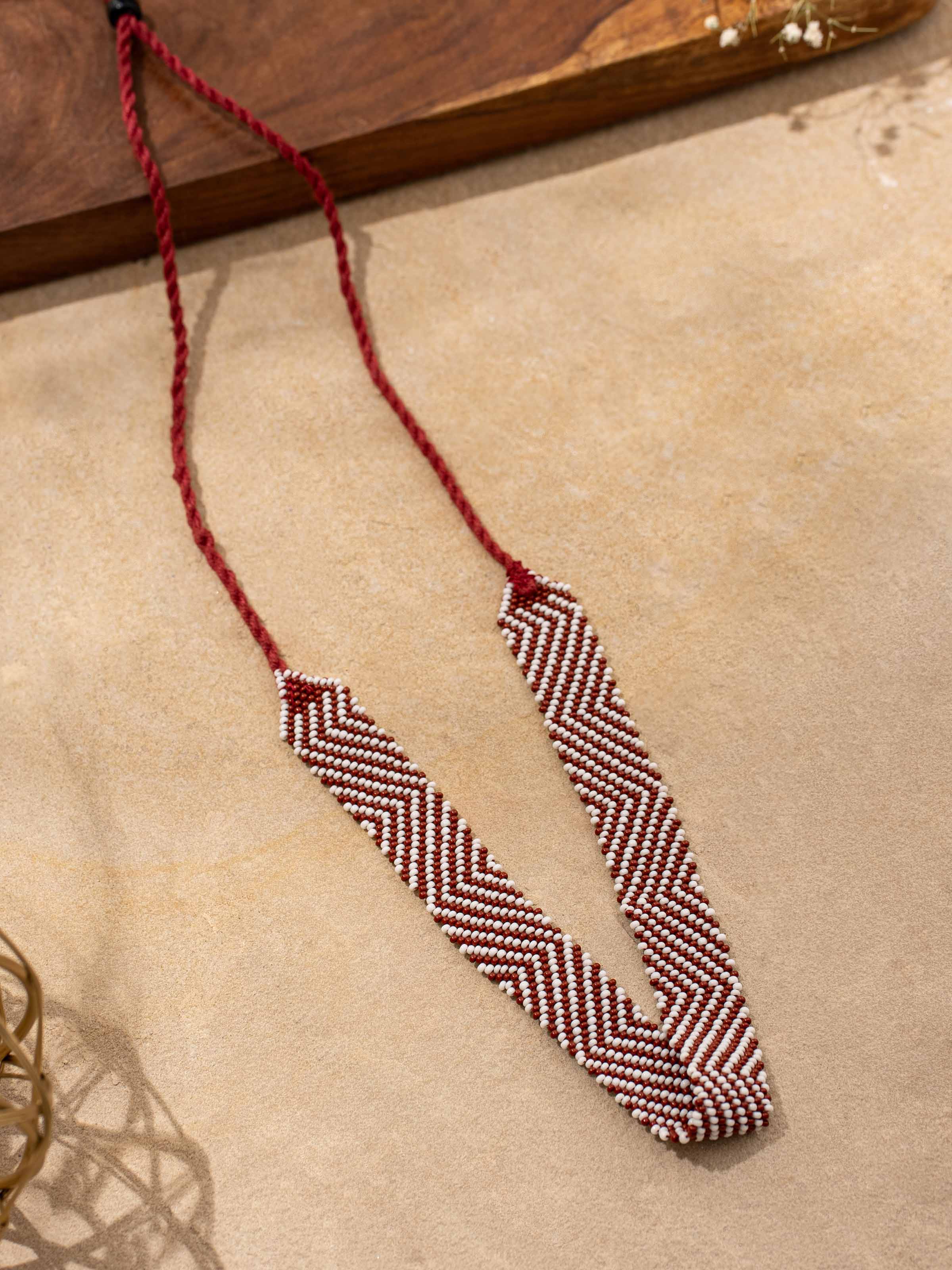 Close-up view of handcrafted long necklace showcasing fine details and artisanal design.