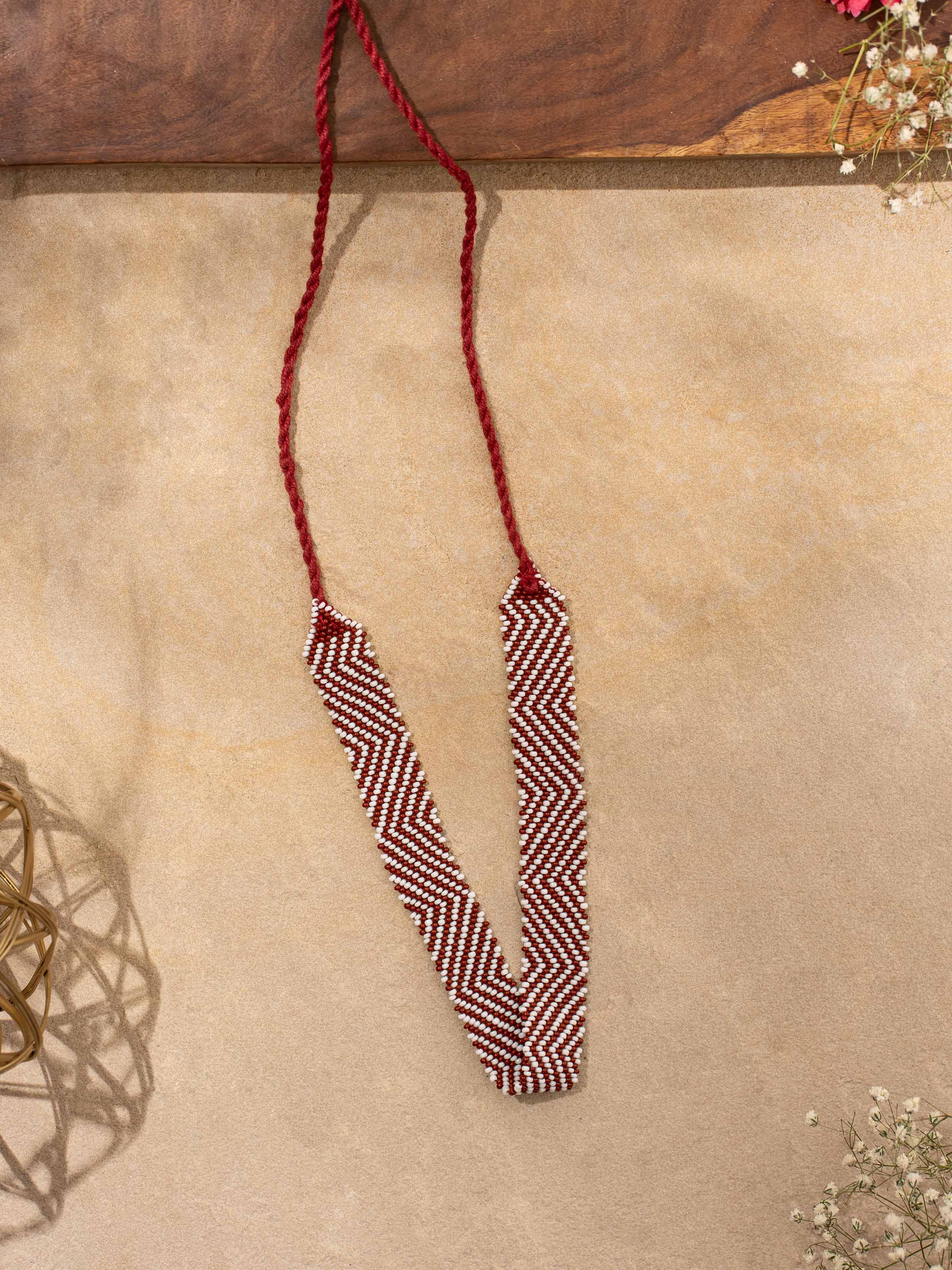 Detailed view of handcrafted long necklace highlighting the intricate design and craftsmanship.