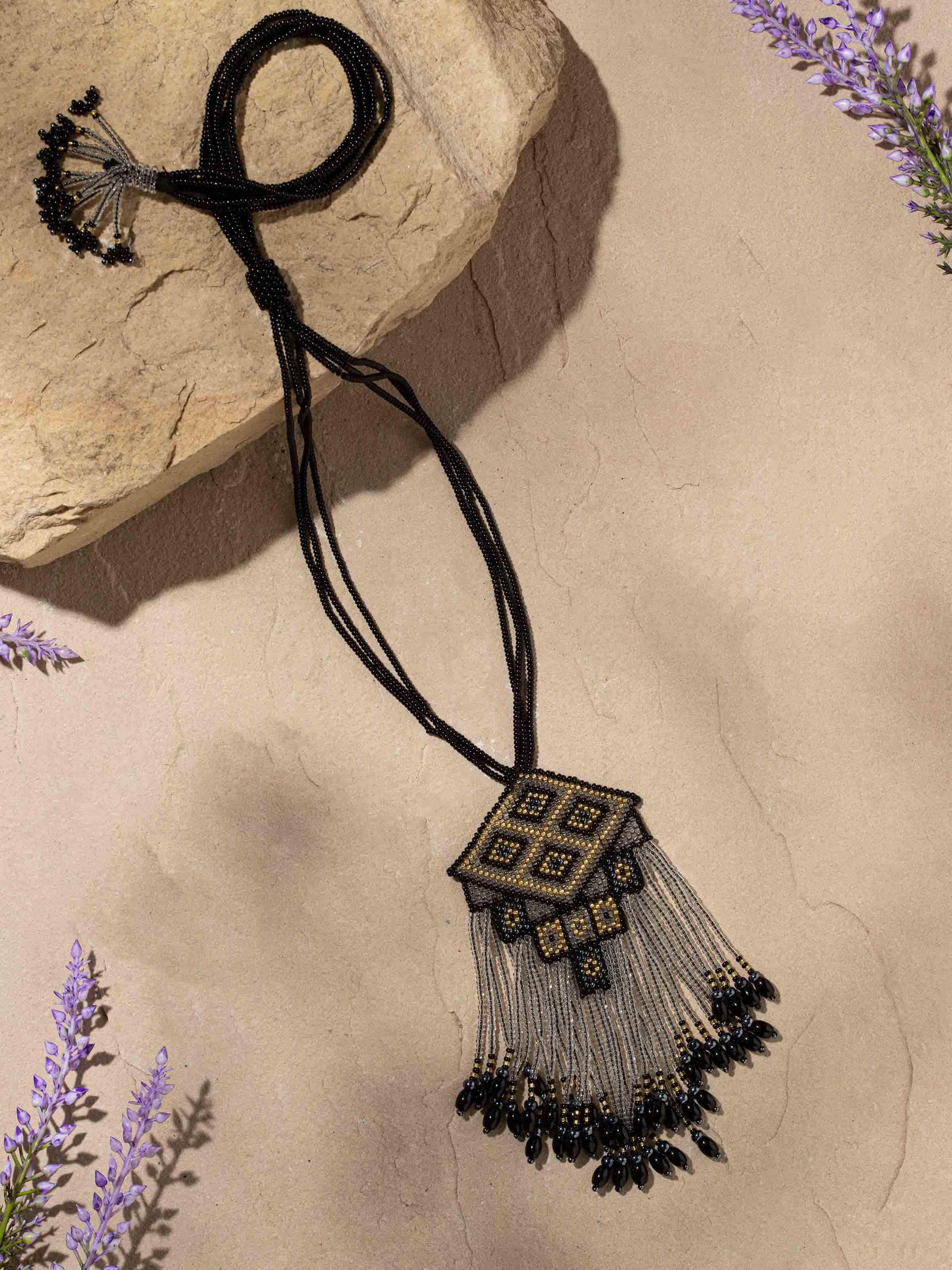 Side view of Glass Bead Long Necklace showing the length and arrangement of beads.