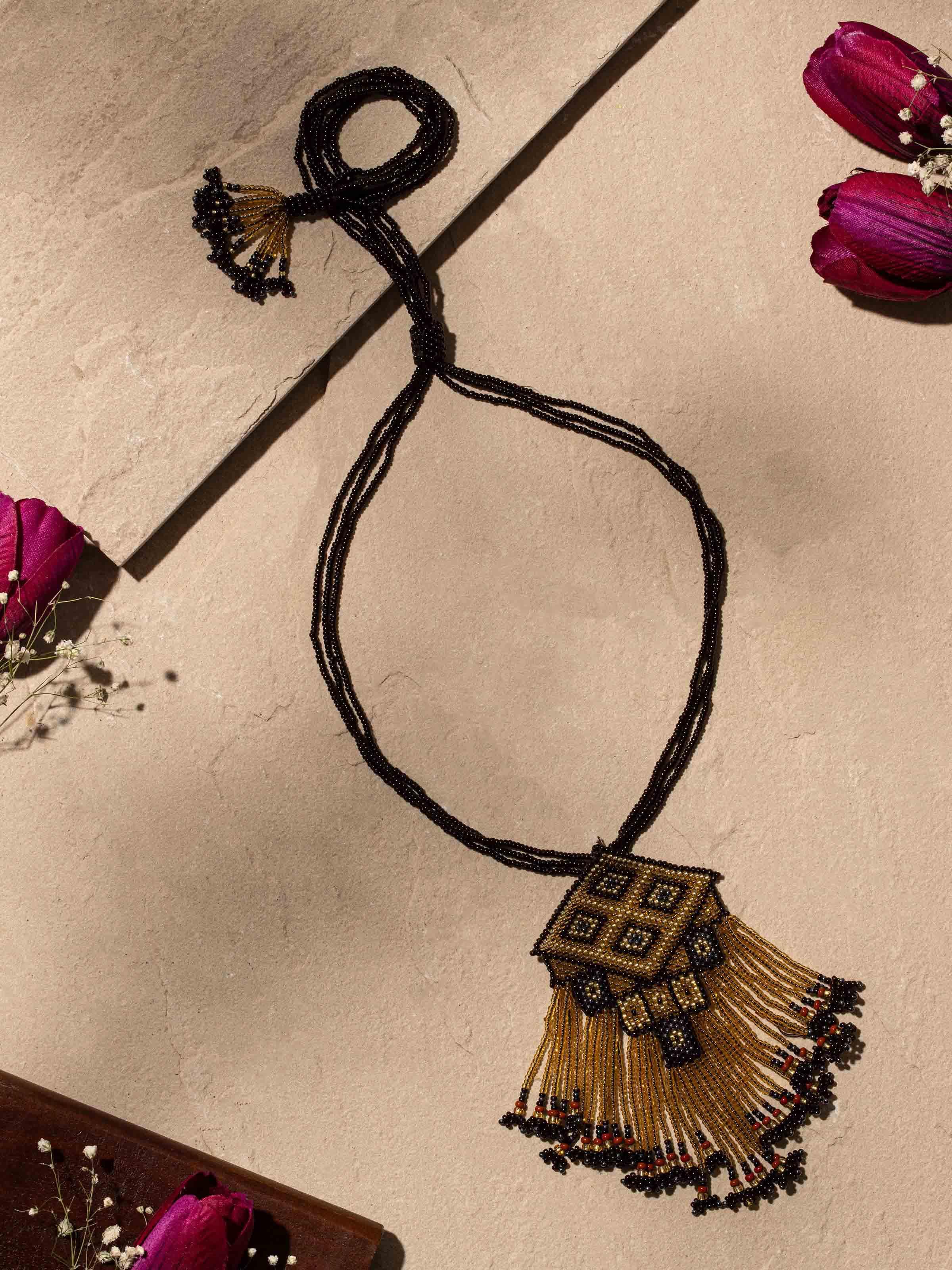 Close-up of glass bead long necklace highlighting detailed beadwork