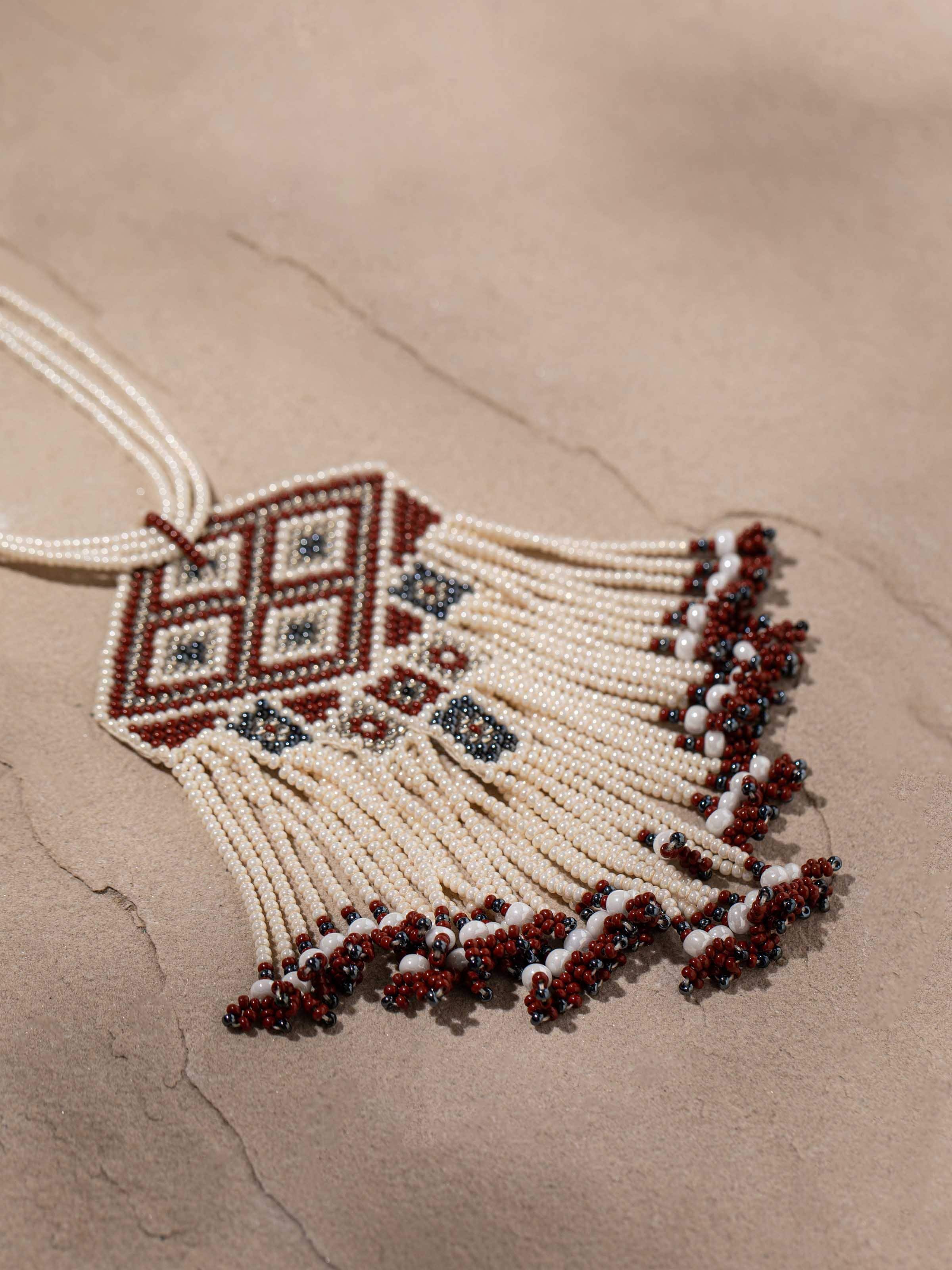 Detailed front view of glass bead long necklace showcasing its vibrant colors