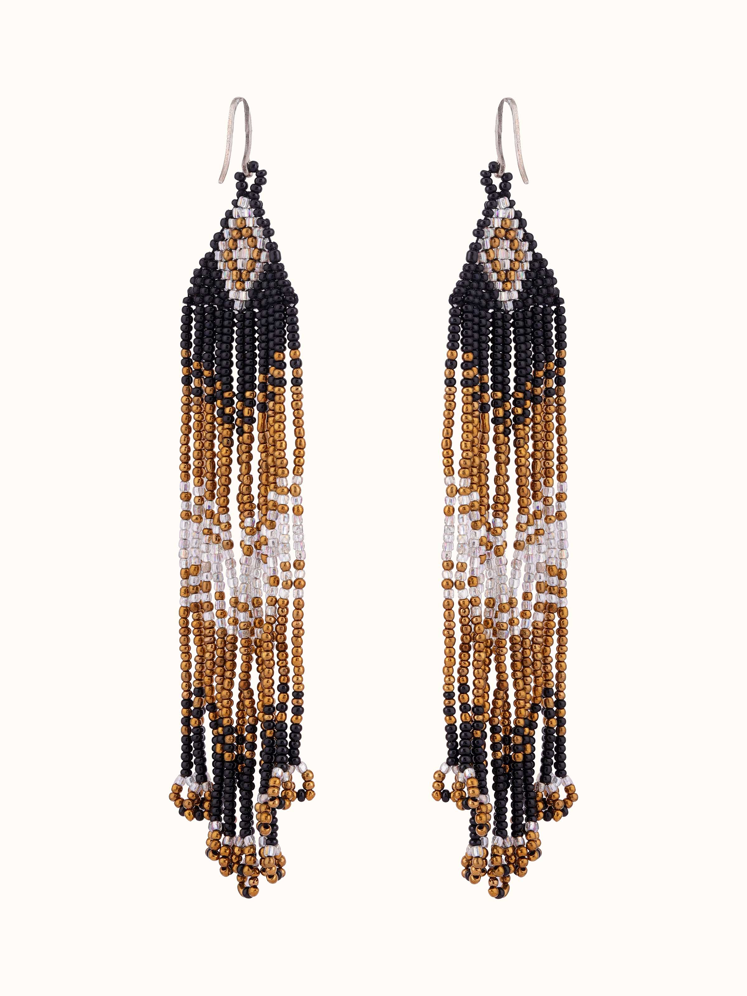 Front view of Silver Smithing Drop Earrings featuring intricate silver detailing.