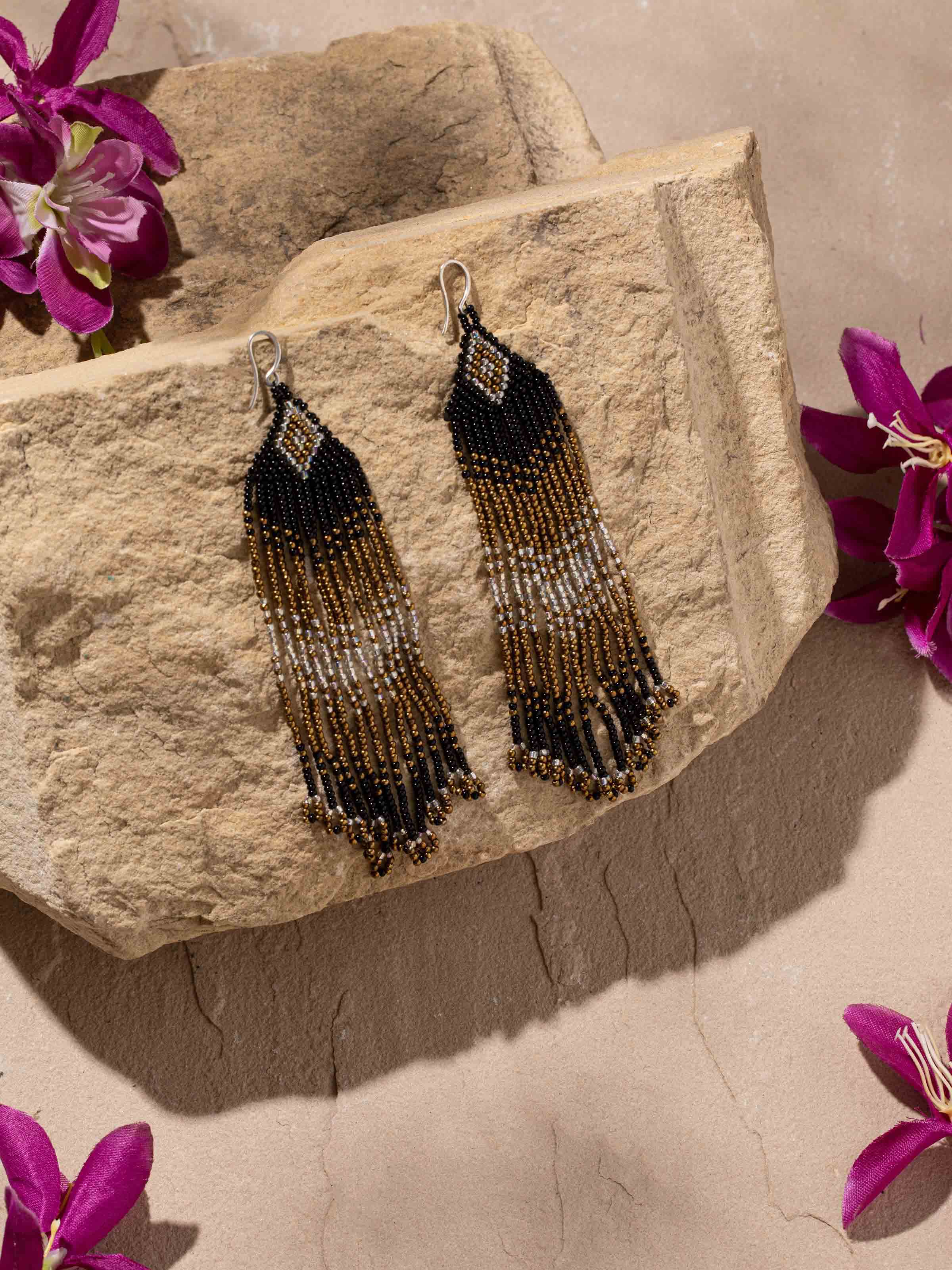 Side view of Silver Smithing Drop Earrings illustrating their elegant design.