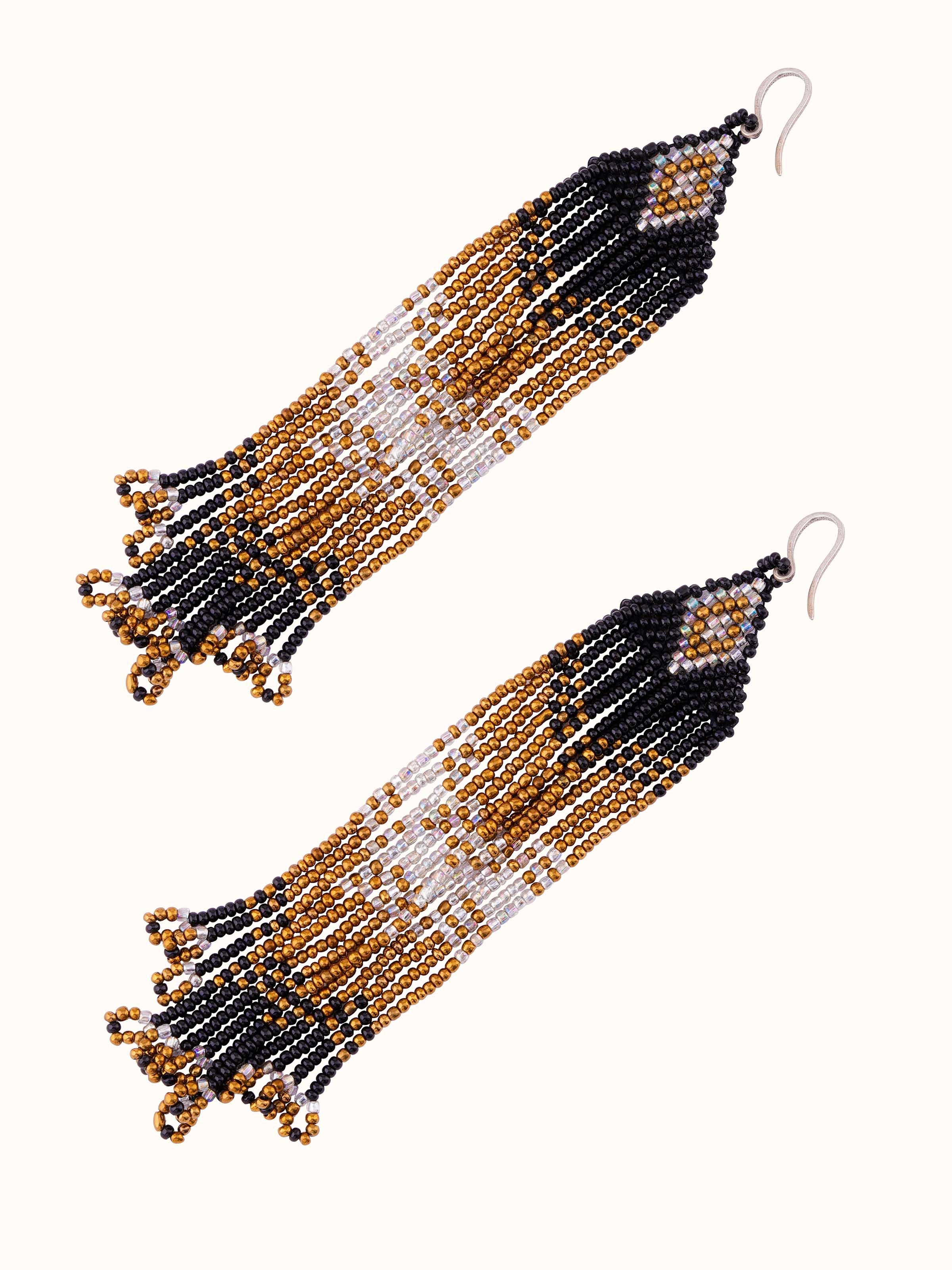 Angled view of Silver Smithing Drop Earrings showcasing detailed craftsmanship.